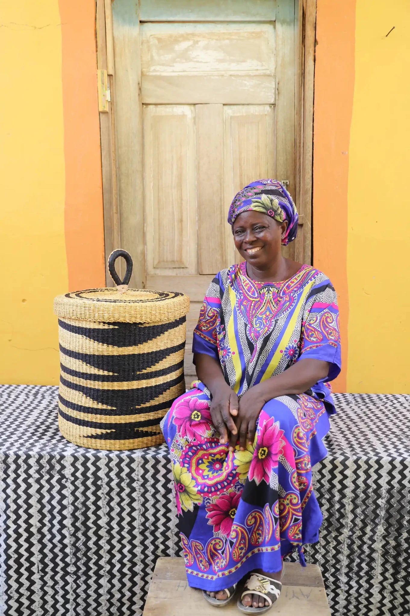 Lidded Laundry Basket  (Small) by The Baba Tree. Handwoven elephant grass
with leather handle. Premium Bolgatanga artisan decor.