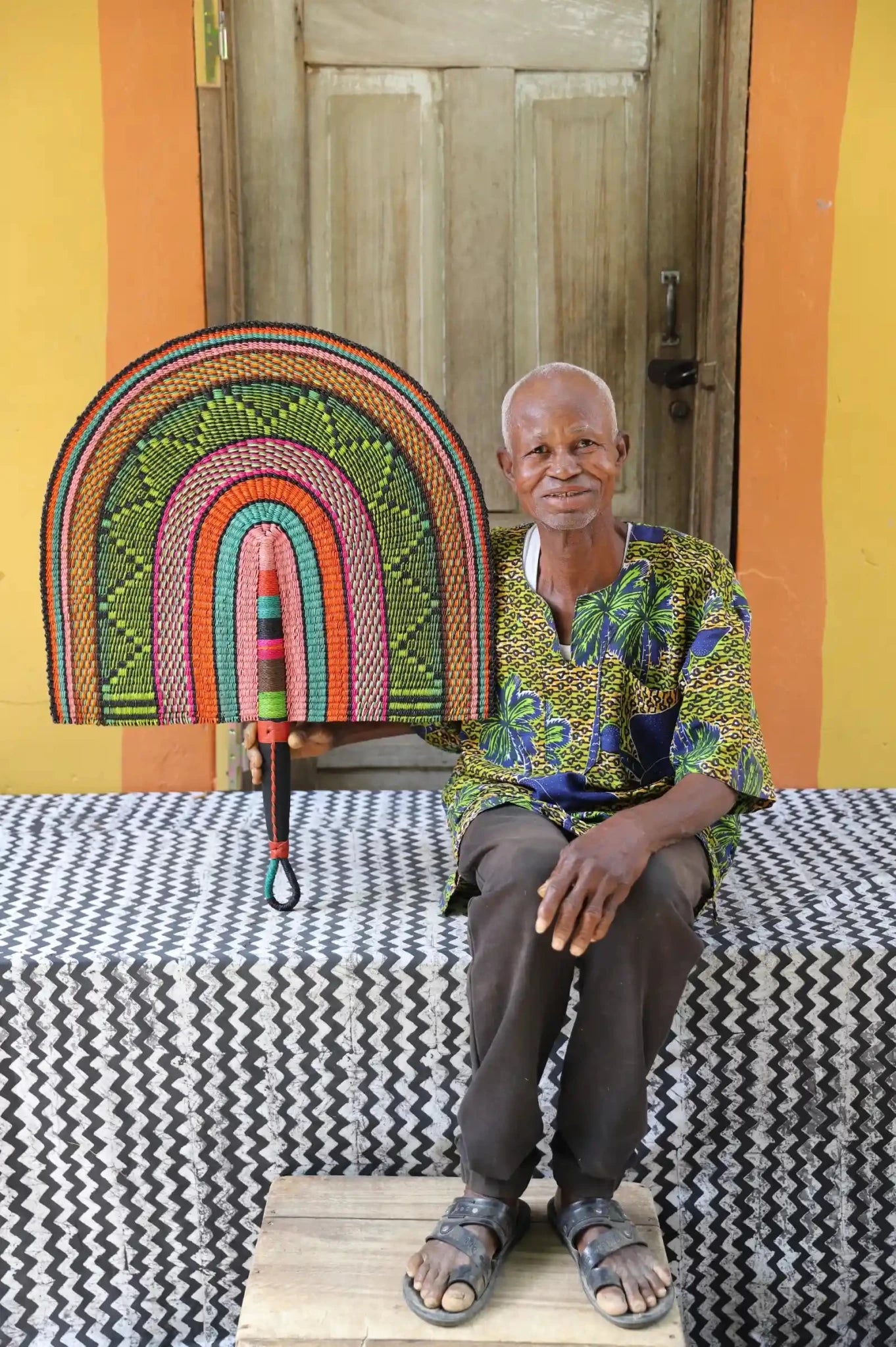 Naba Pengo Fan by The Baba Tree. Premium handwoven elephant grass wall art and artisanal Bolgatanga home decor.