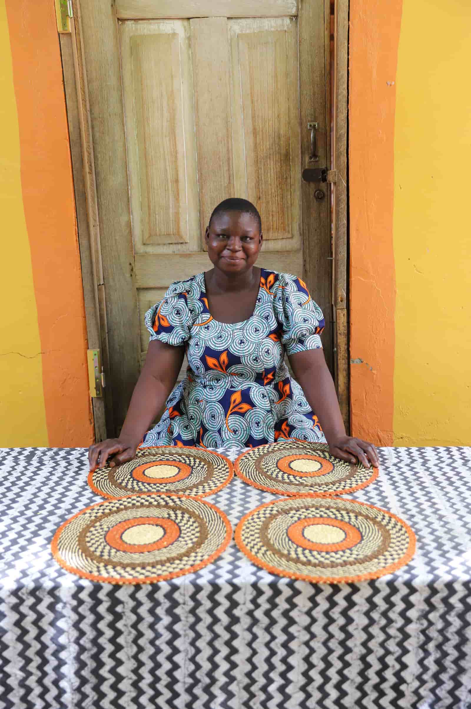 Set of 4 large placemats in orange with natural straw and checkered weave detailing