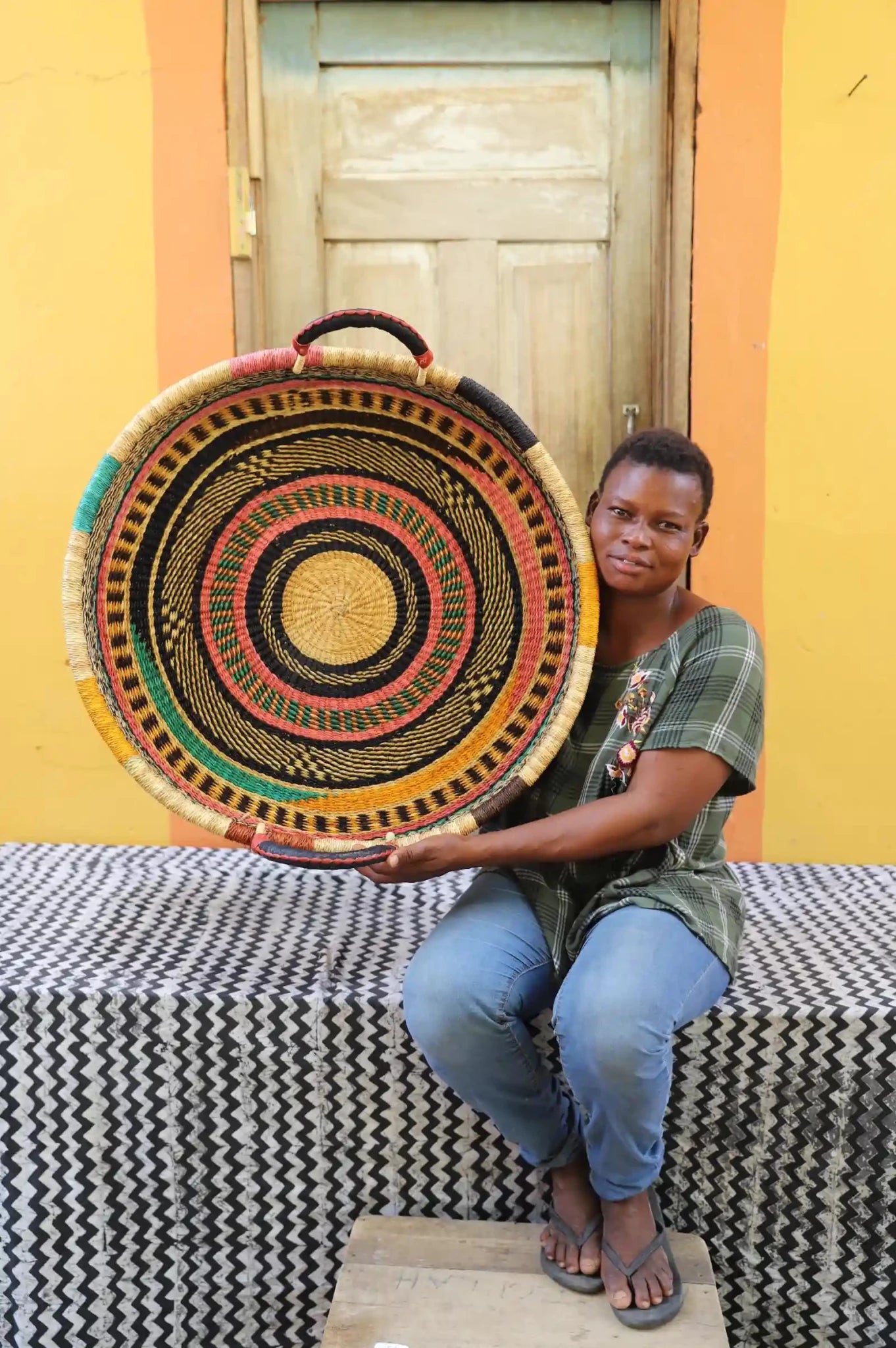 Premium elephant grass tray with leather handles. Bolgatanga artisan craftsmanship.