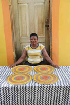 Set of 4 large placemats in yellow, orange and brown concentric weave bands