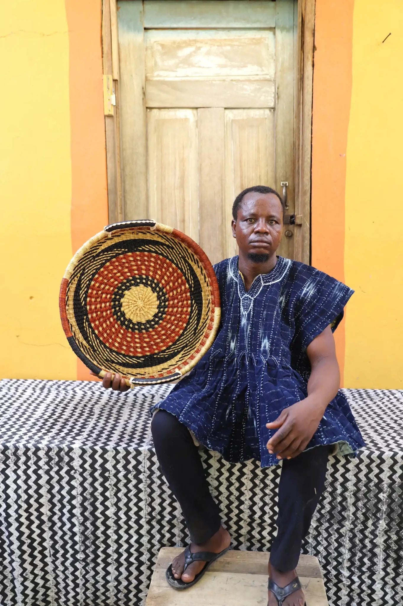 Premium elephant grass tray with leather handles. Bolgatanga artisan craftsmanship.