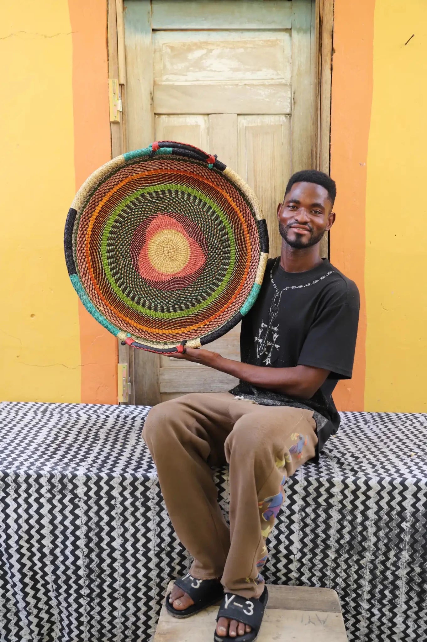 Premium elephant grass tray with leather handles. Bolgatanga artisan craftsmanship.