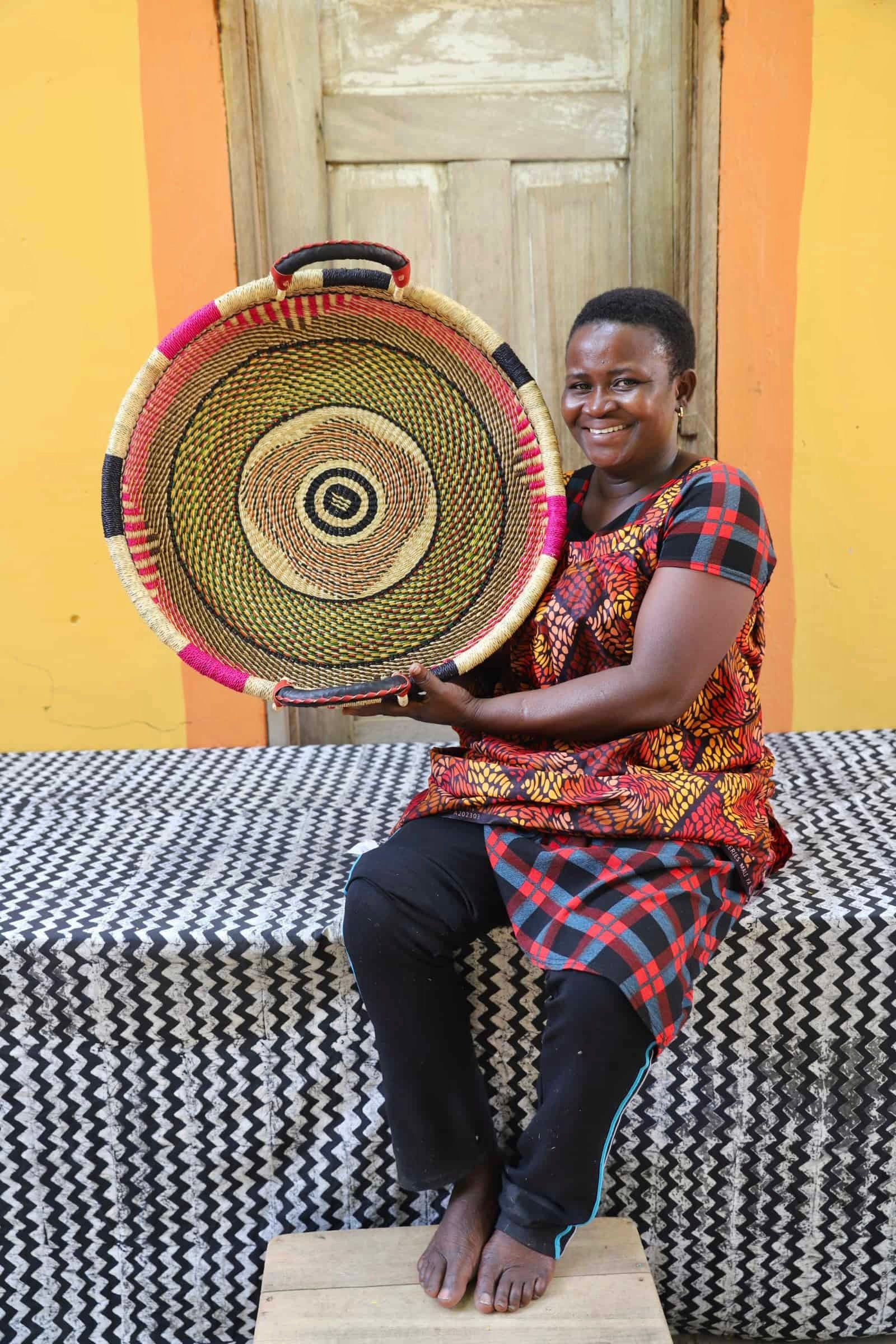 Woven Tray Wall Decor (Medium) by The Baba Tree. Premium elephant grass tray
with leather handles. Bolgatanga artisan craftsmanship.