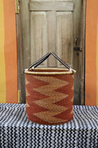 Open Laundry Basket (Large) by The Baba Tree. Handwoven elephant grass storage with leather handles. Bolgatanga artisan decor.