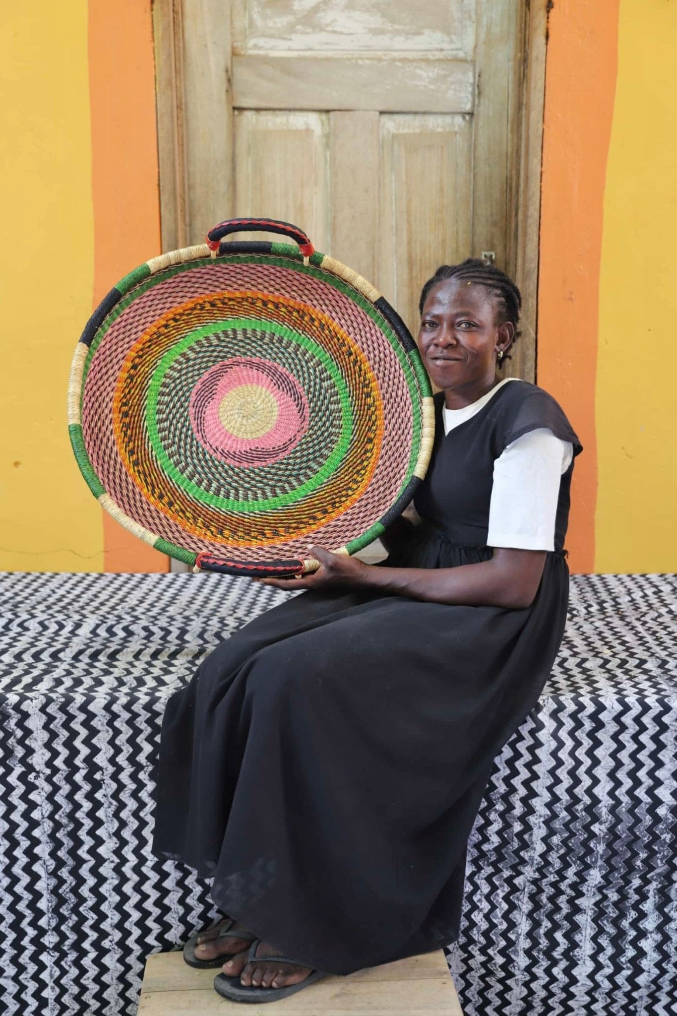 Woven Tray Wall Decor (Medium) by The Baba Tree. Premium elephant grass tray
with leather handles. Bolgatanga artisan craftsmanship.