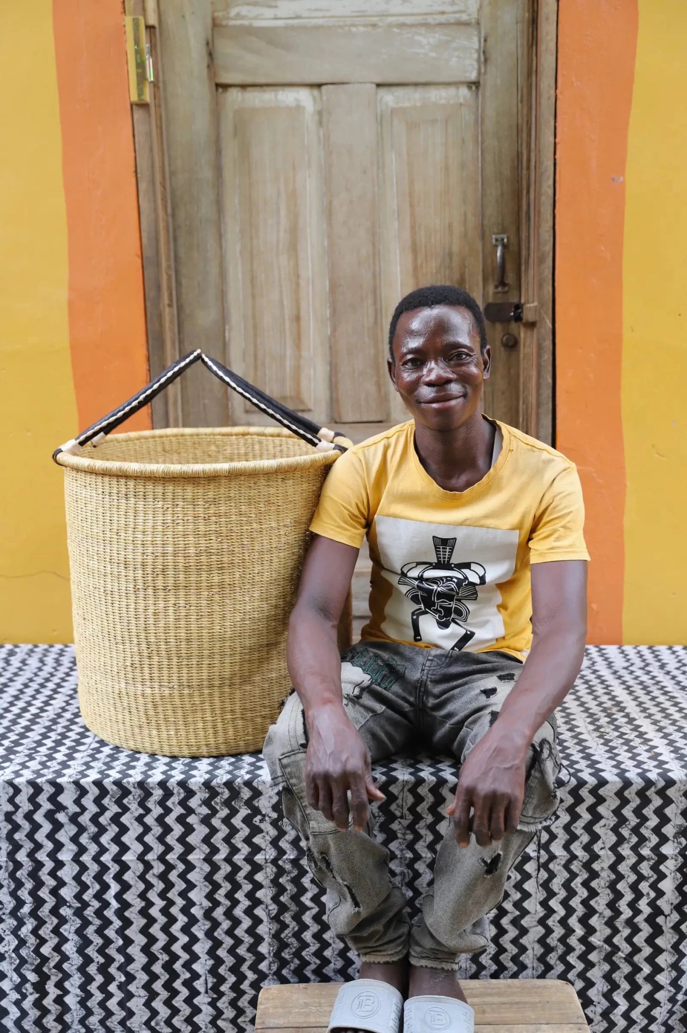 Open Laundry Basket (Large) by The Baba Tree. Handwoven elephant grass storage with leather handles. Bolgatanga artisan decor.