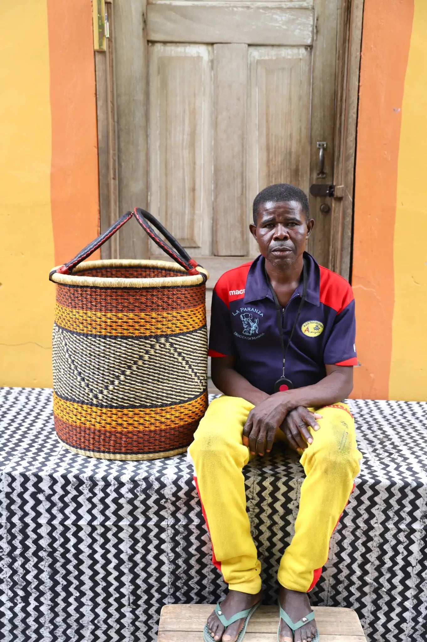 Open Laundry Basket (Medium) by The Baba Tree. Handwoven elephant grass storage with leather handles. Bolgatanga artisan decor.