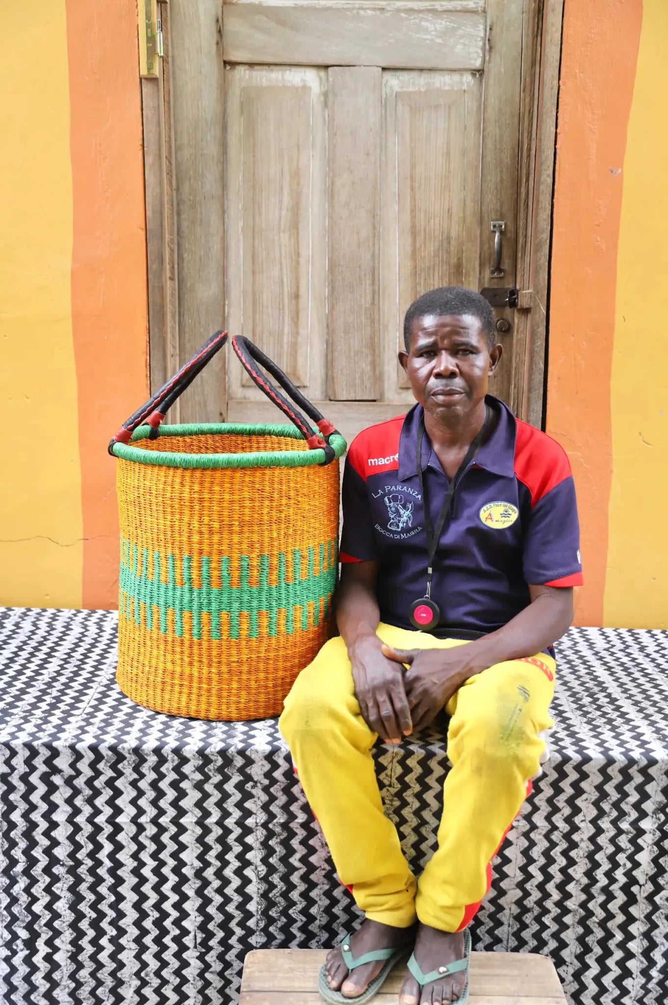 Open Laundry Basket (Small) by The Baba Tree. Handwoven elephant grass storage with leather handles. Bolgatanga artisan decor.