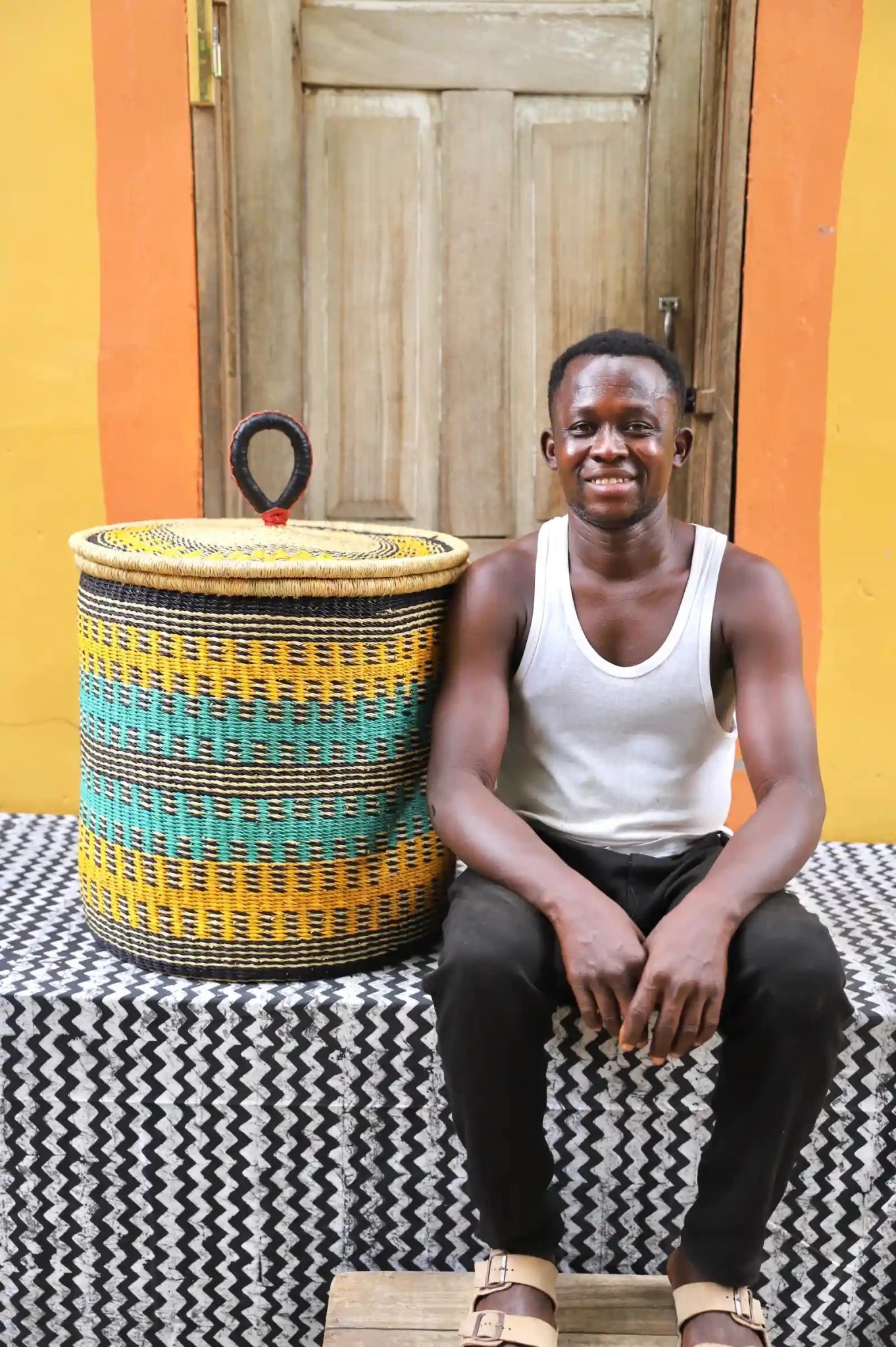 Lidded Laundry Basket with coil (Large) by The Baba Tree. Handwoven elephant grass with leather handle. Premium Bolgatanga artisan decor.