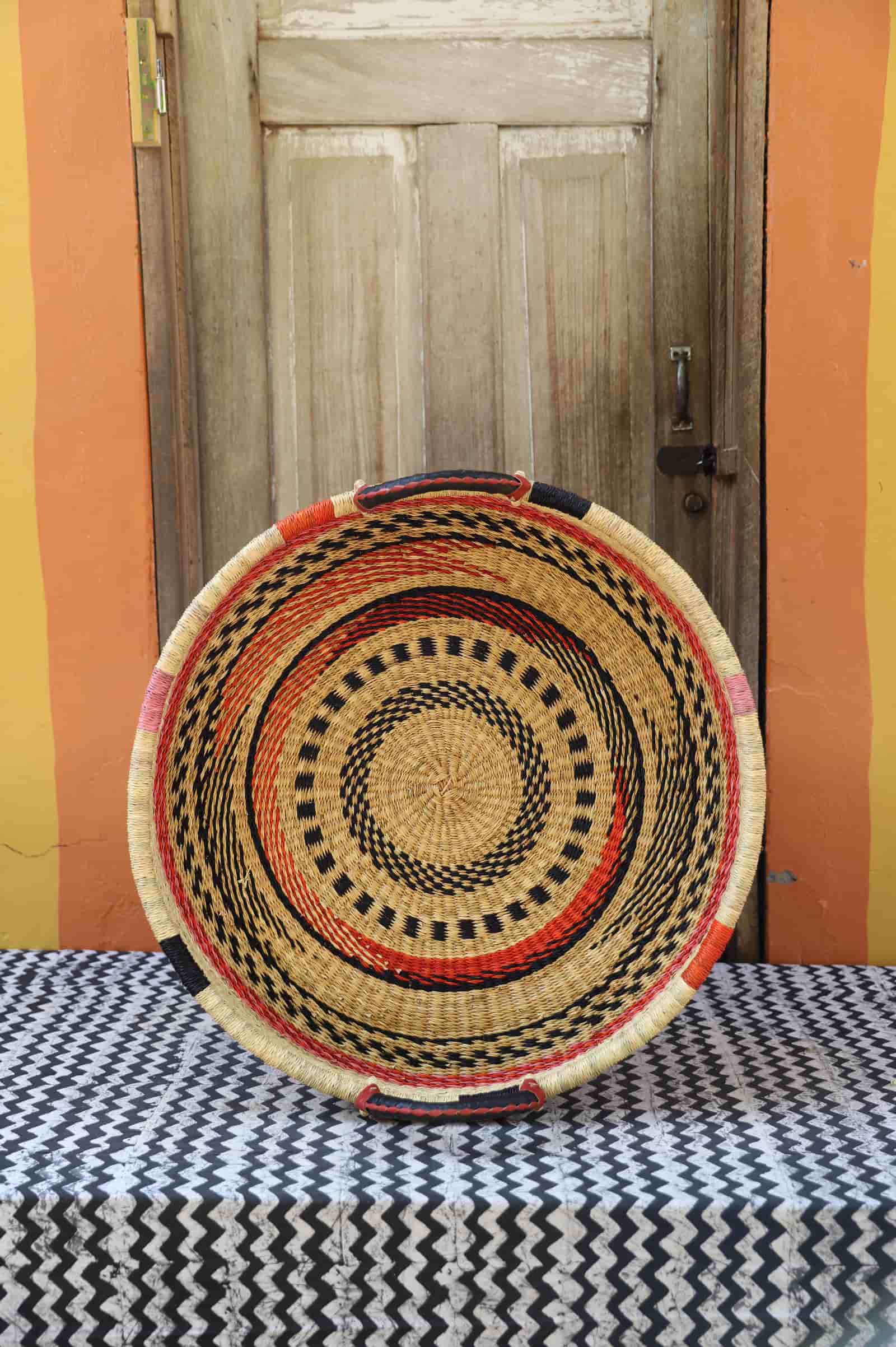 Premium elephant grass tray with leather handles. Bolgatanga artisan craftsmanship.