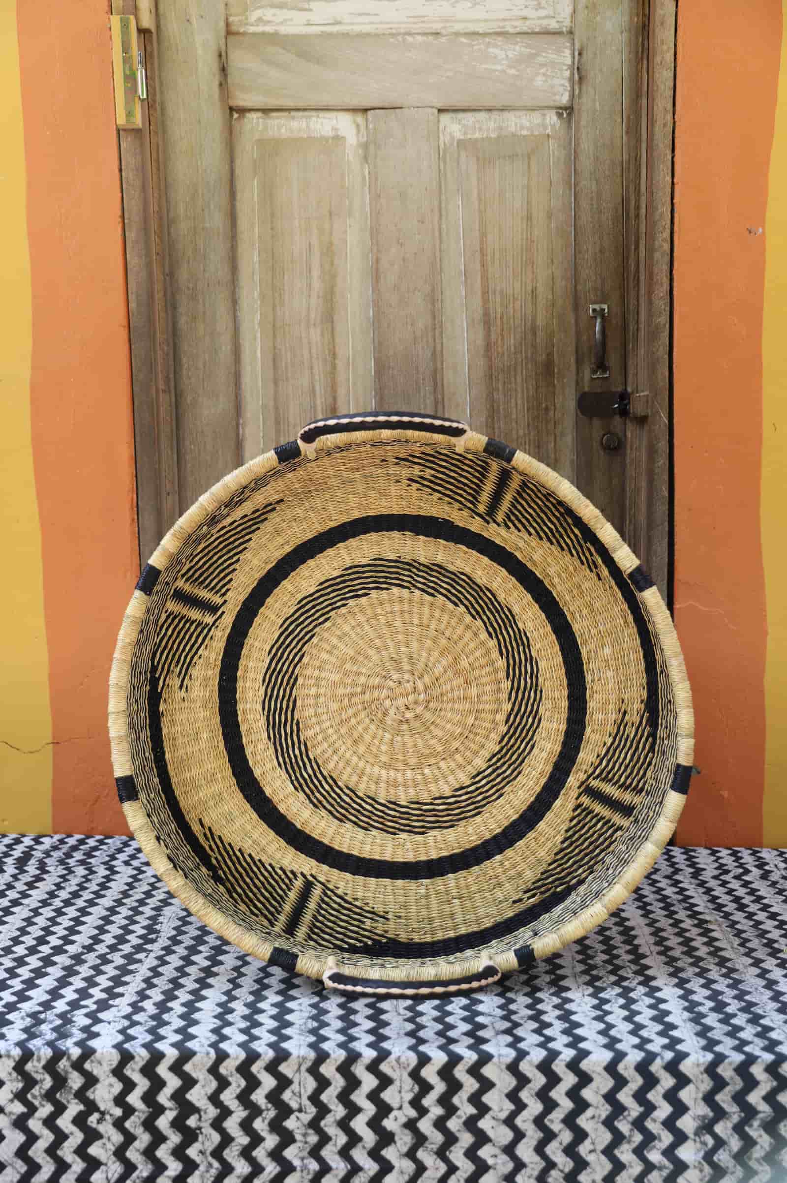 Premium elephant grass tray with leather handles. Bolgatanga artisan craftsmanship.