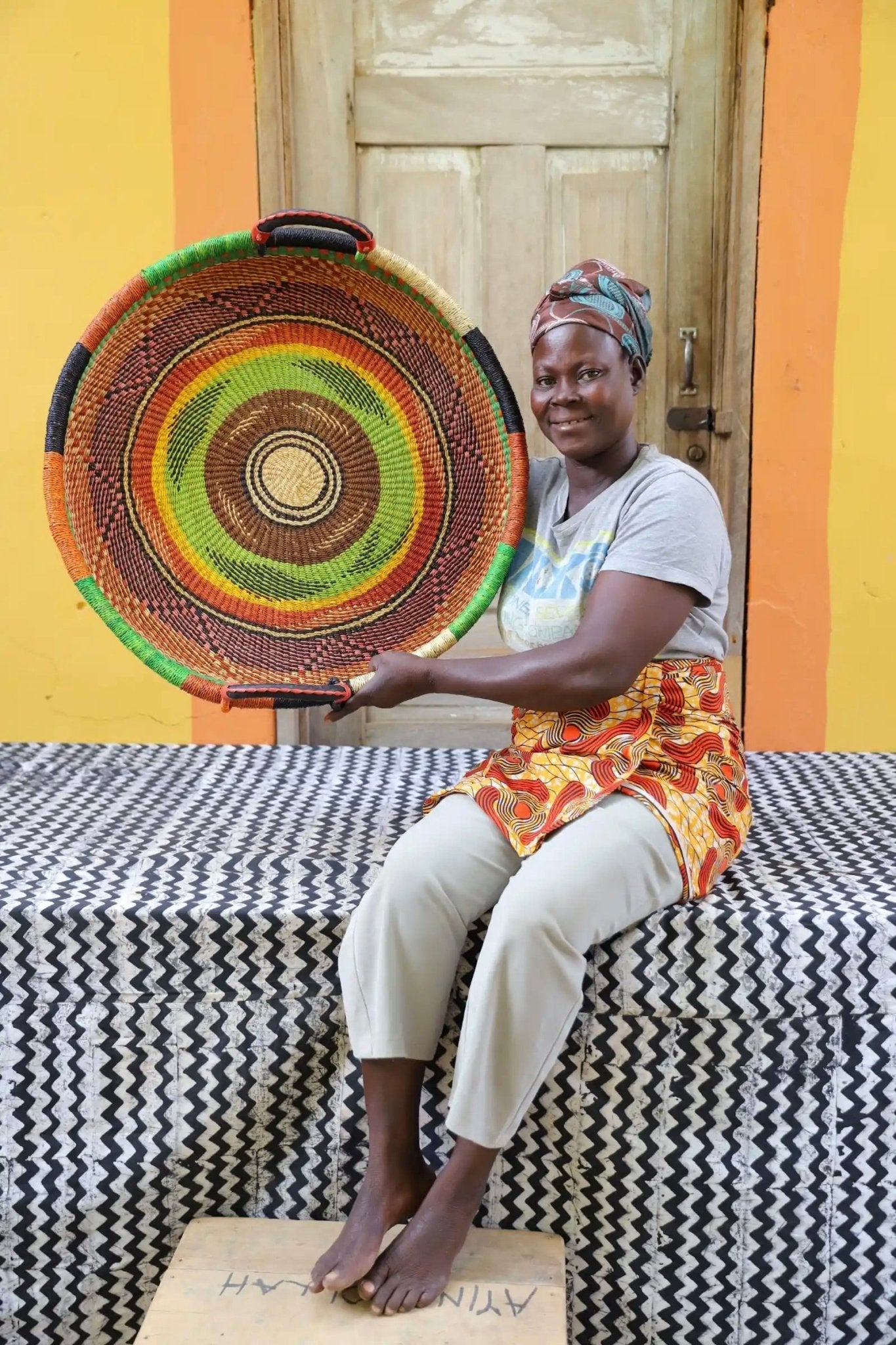 Woven Tray Wall Decor (Medium) by The Baba Tree. Premium elephant grass tray
with leather handles. Bolgatanga artisan craftsmanship.