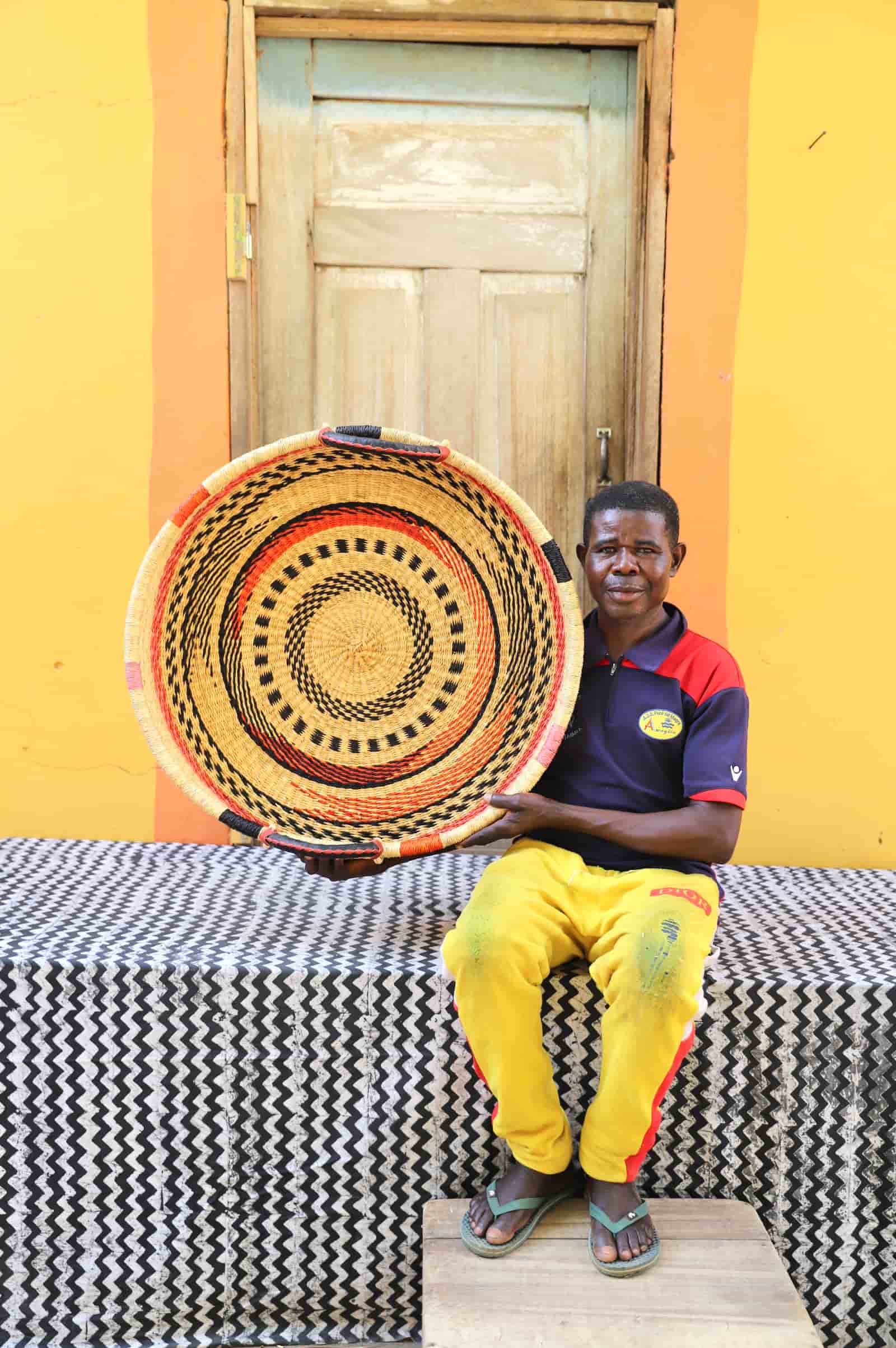 Premium elephant grass tray with leather handles. Bolgatanga artisan craftsmanship.