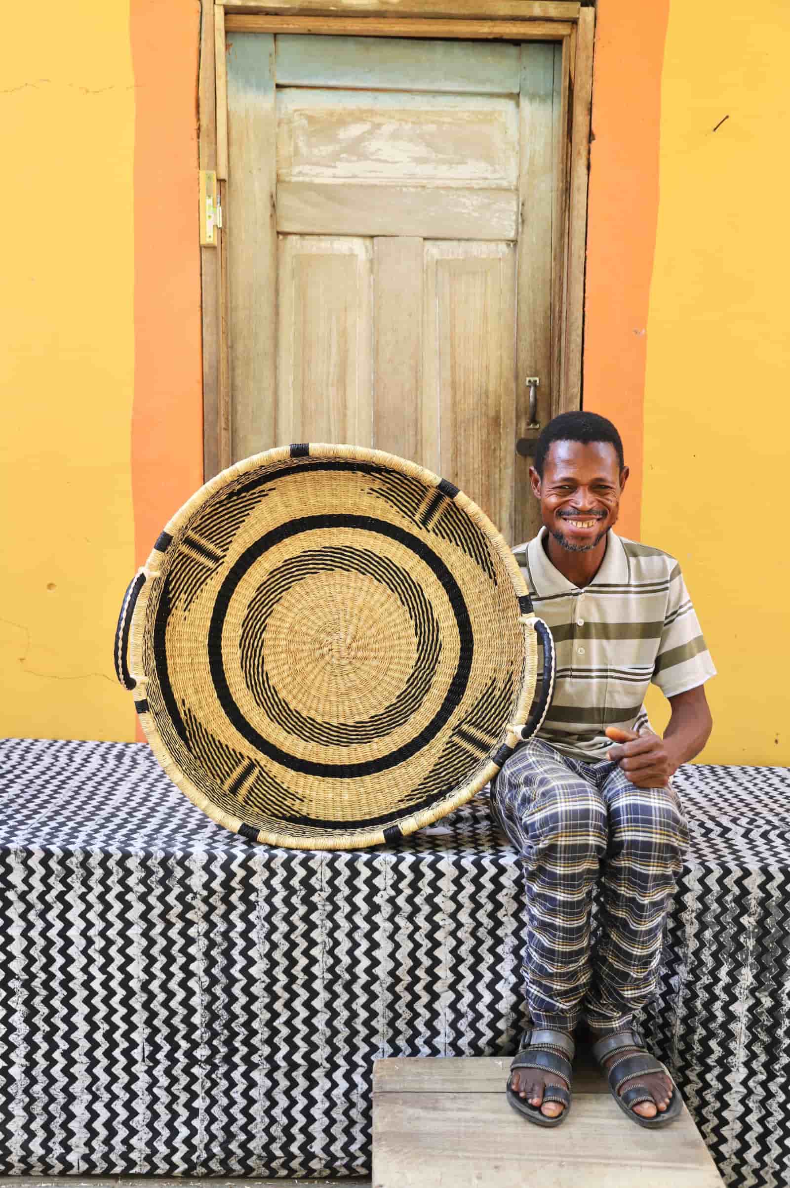 Premium elephant grass tray with leather handles. Bolgatanga artisan craftsmanship.