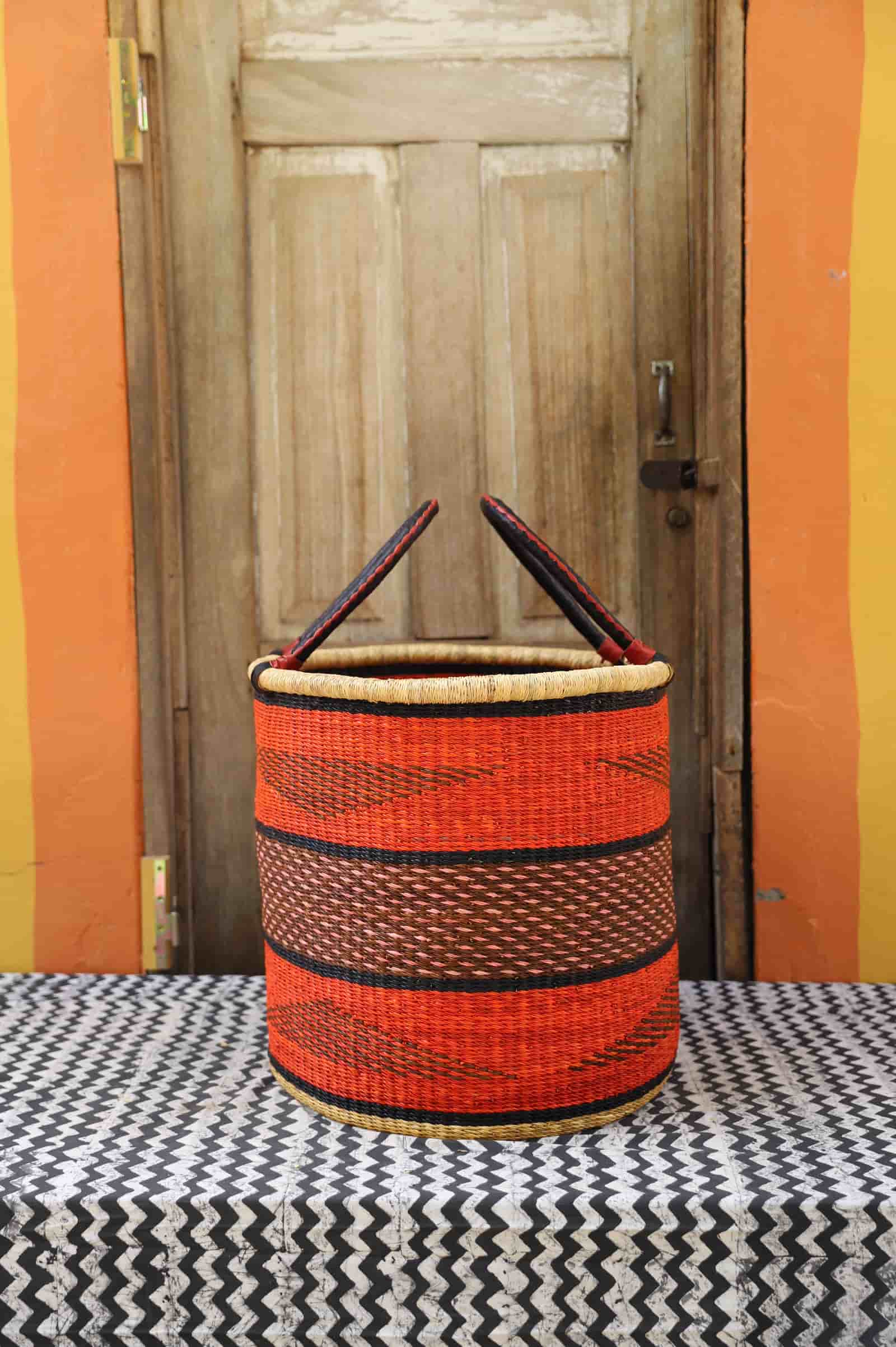 Open Laundry Basket (Large) by The Baba Tree. Handwoven elephant grass storage with leather handles. Bolgatanga artisan decor.