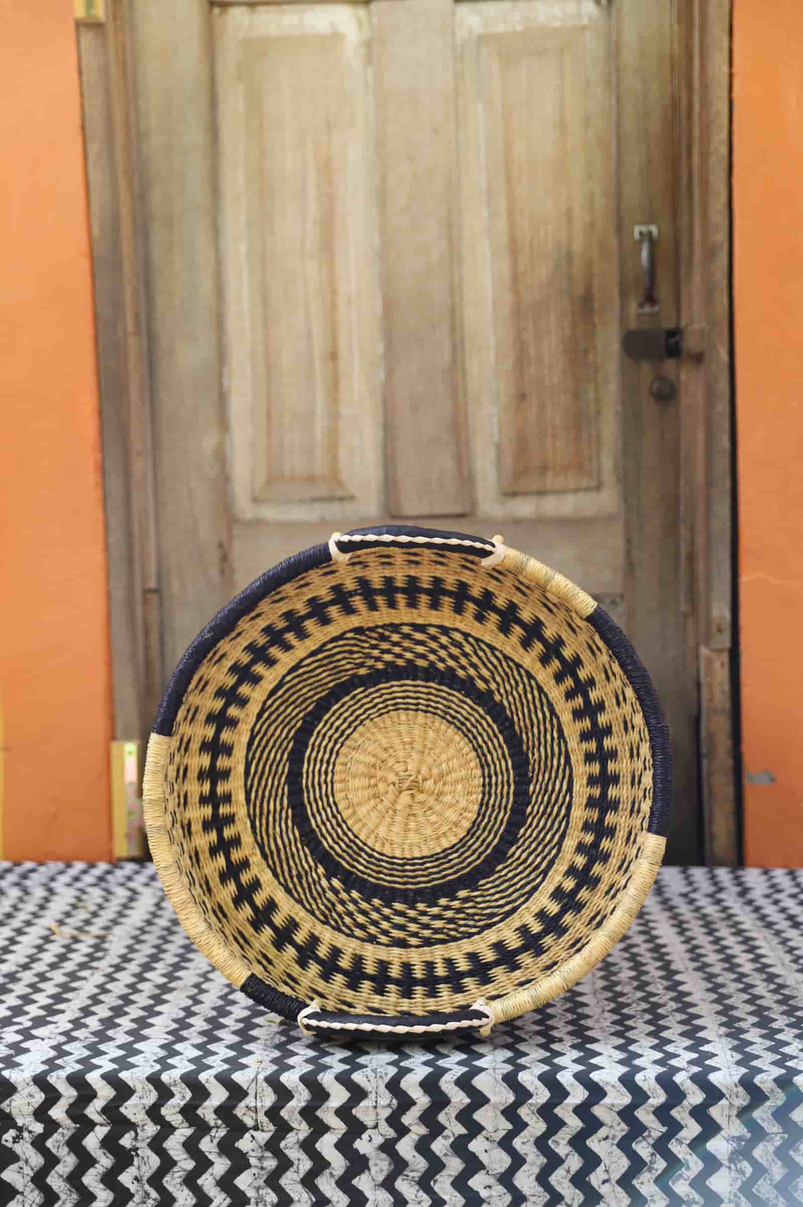 Premium elephant grass tray with leather handles. Bolgatanga artisan craftsmanship.