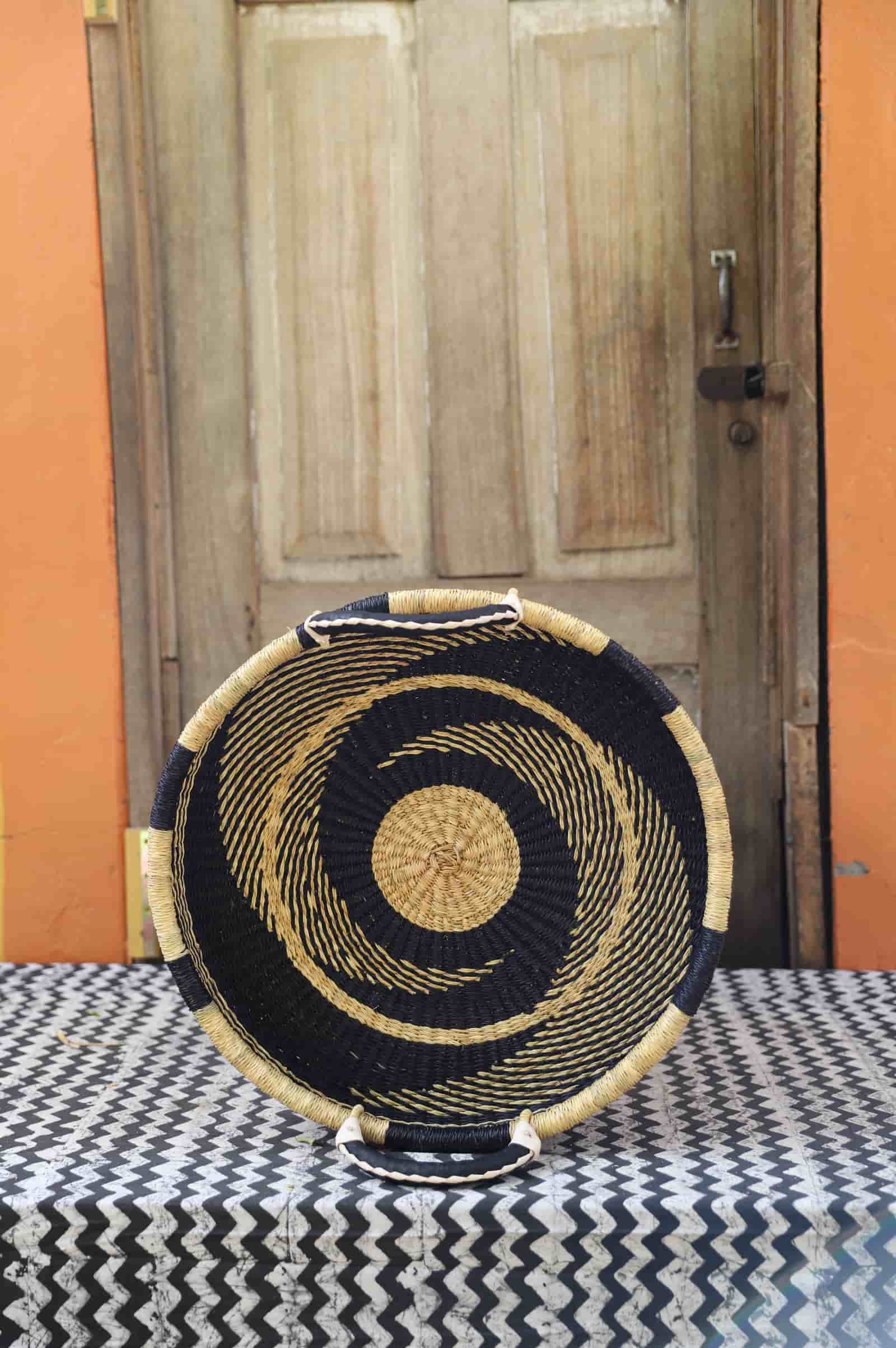 Premium elephant grass tray with leather handles. Bolgatanga artisan craftsmanship.