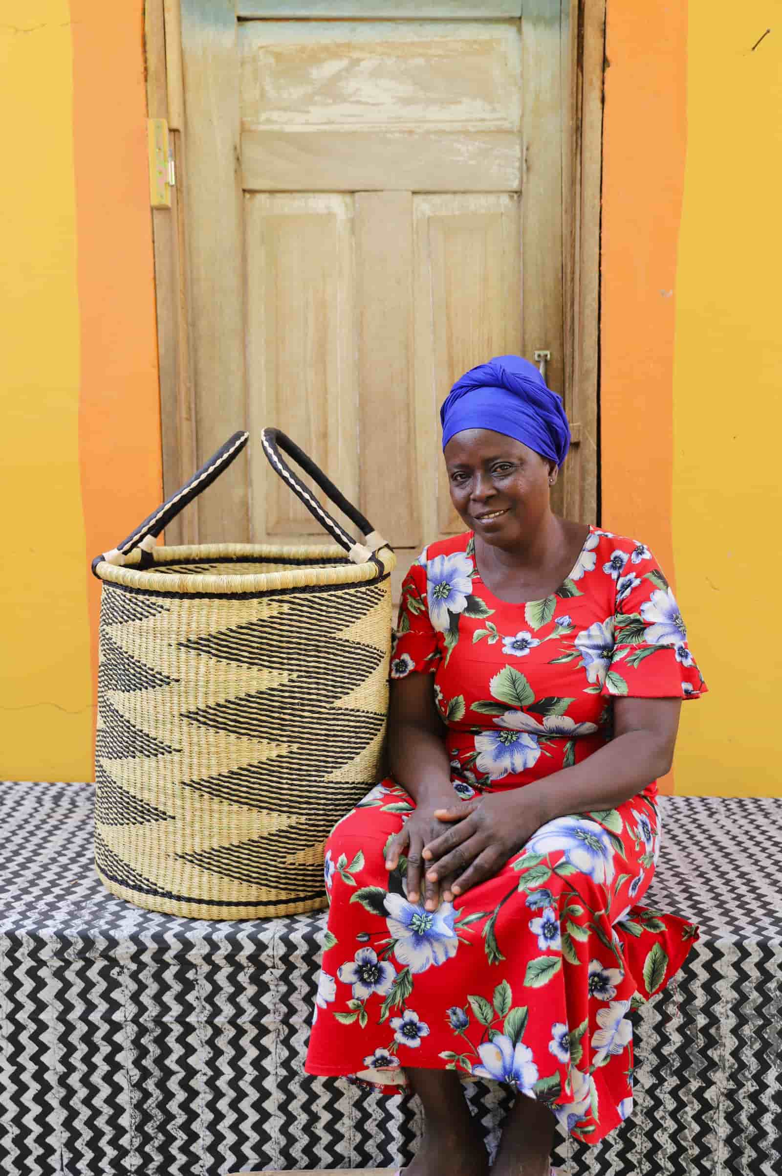 Open Laundry Basket (Large) by The Baba Tree. Handwoven elephant grass storage with leather handles. Bolgatanga artisan decor.