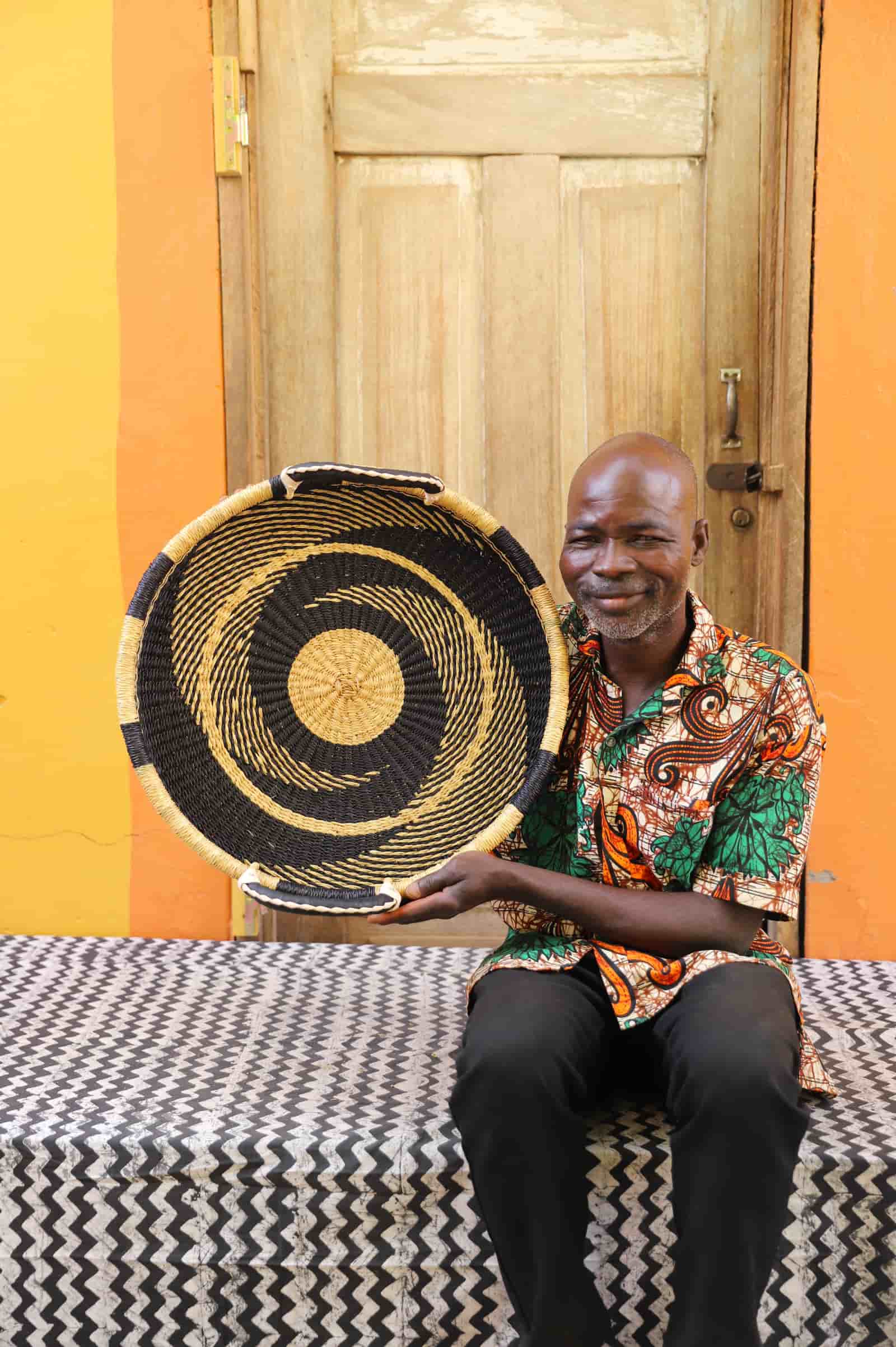 Premium elephant grass tray with leather handles. Bolgatanga artisan craftsmanship.