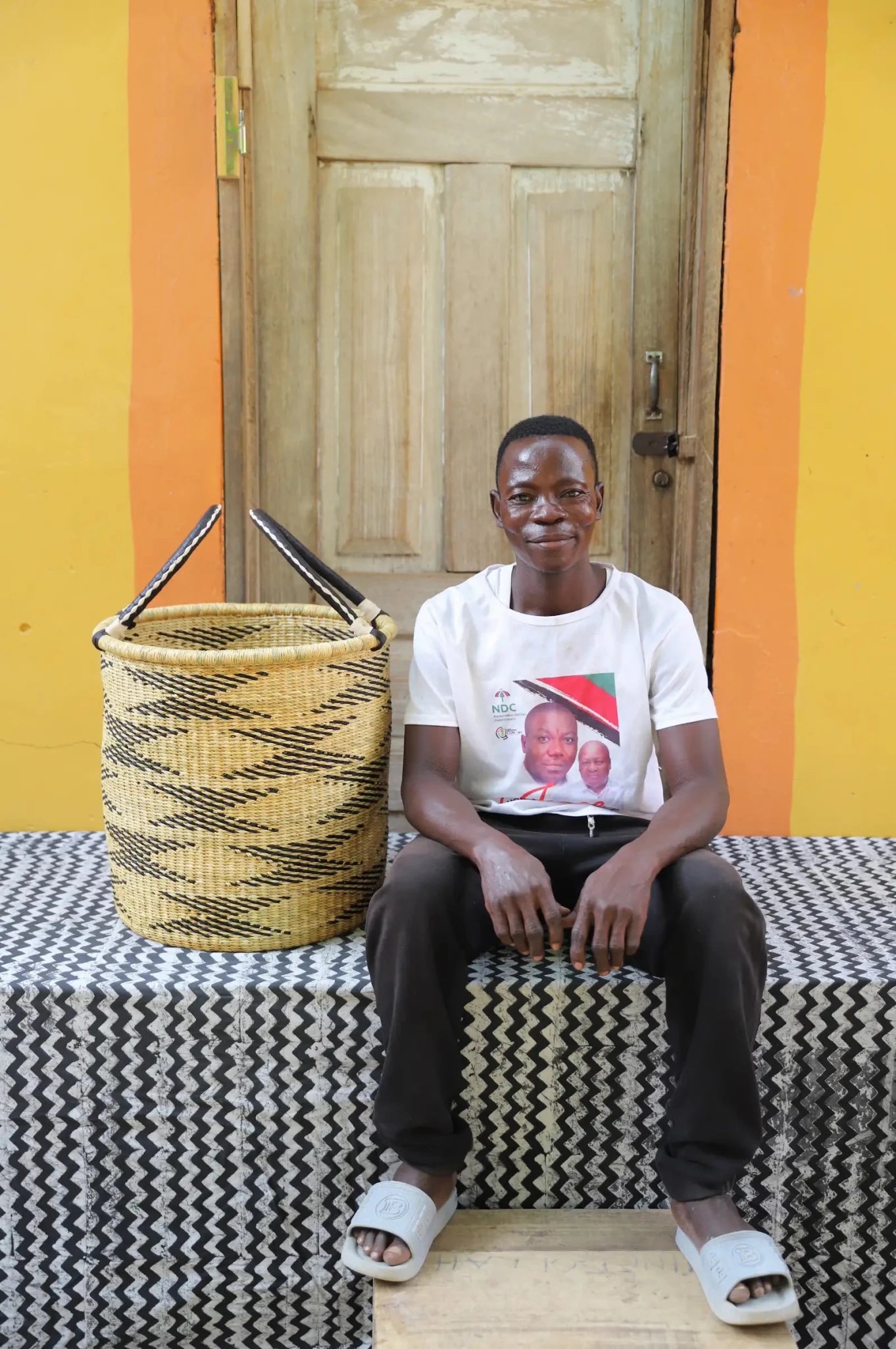 Open Laundry Basket (Small) by The Baba Tree. Handwoven elephant grass storage with leather handles. Bolgatanga artisan decor.