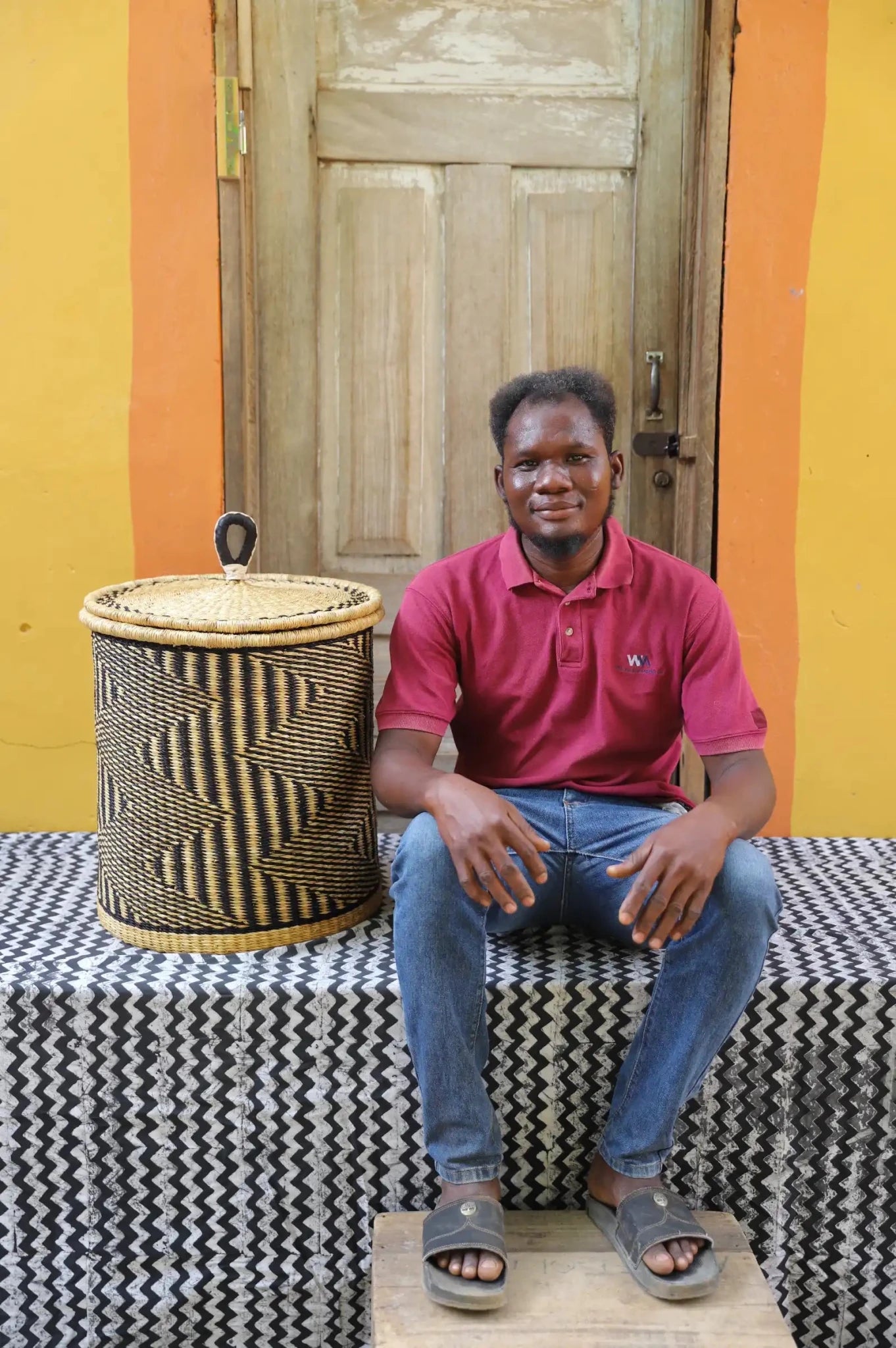 Lidded Laundry Basket with coil (Small) by The Baba Tree. Handwoven elephant grass with leather handle. Premium Bolgatanga artisan decor.