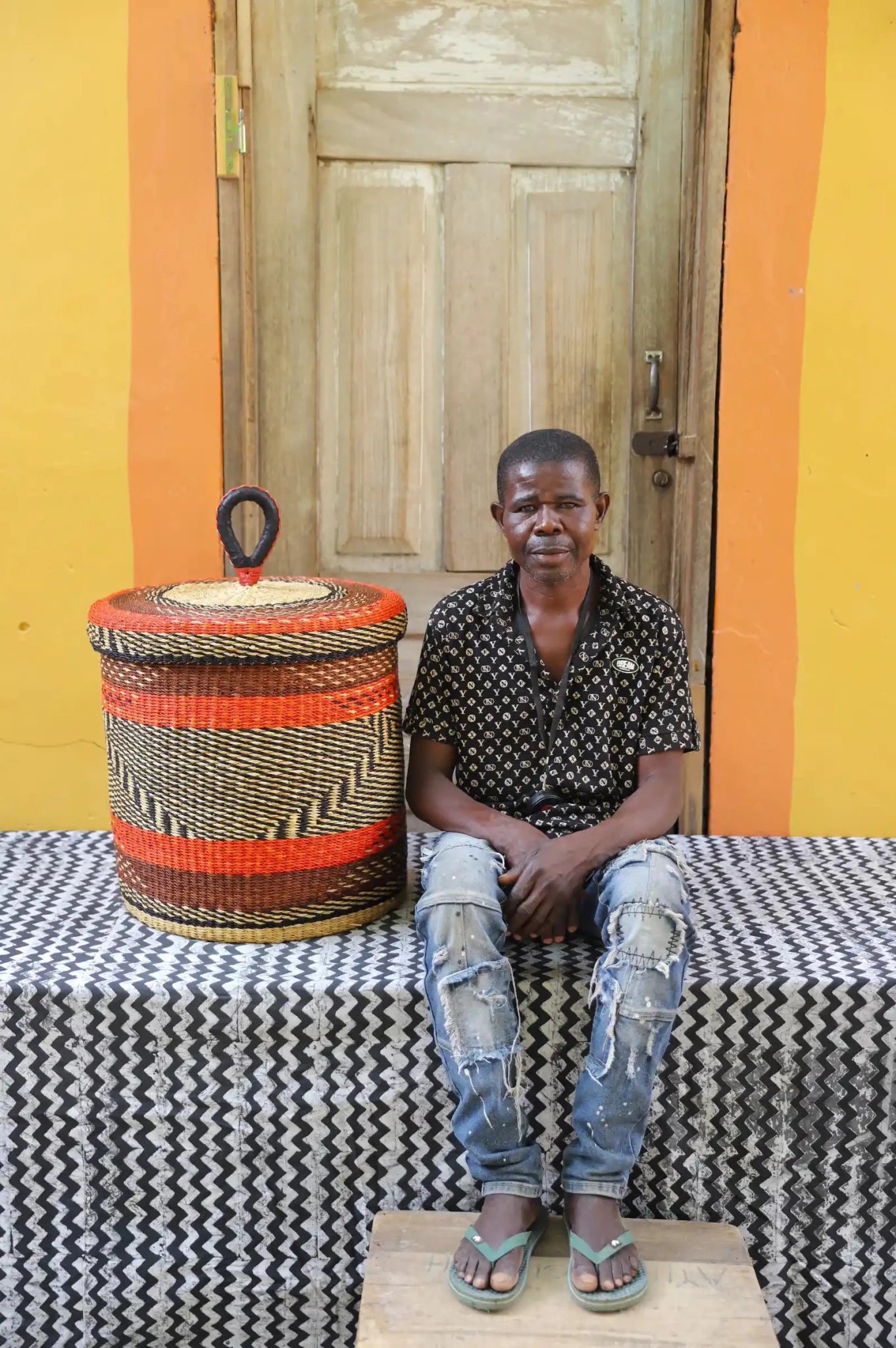 Lidded Laundry Basket (Medium) by The Baba Tree. Handwoven elephant grass with leather handle. Premium Bolgatanga artisan decor.