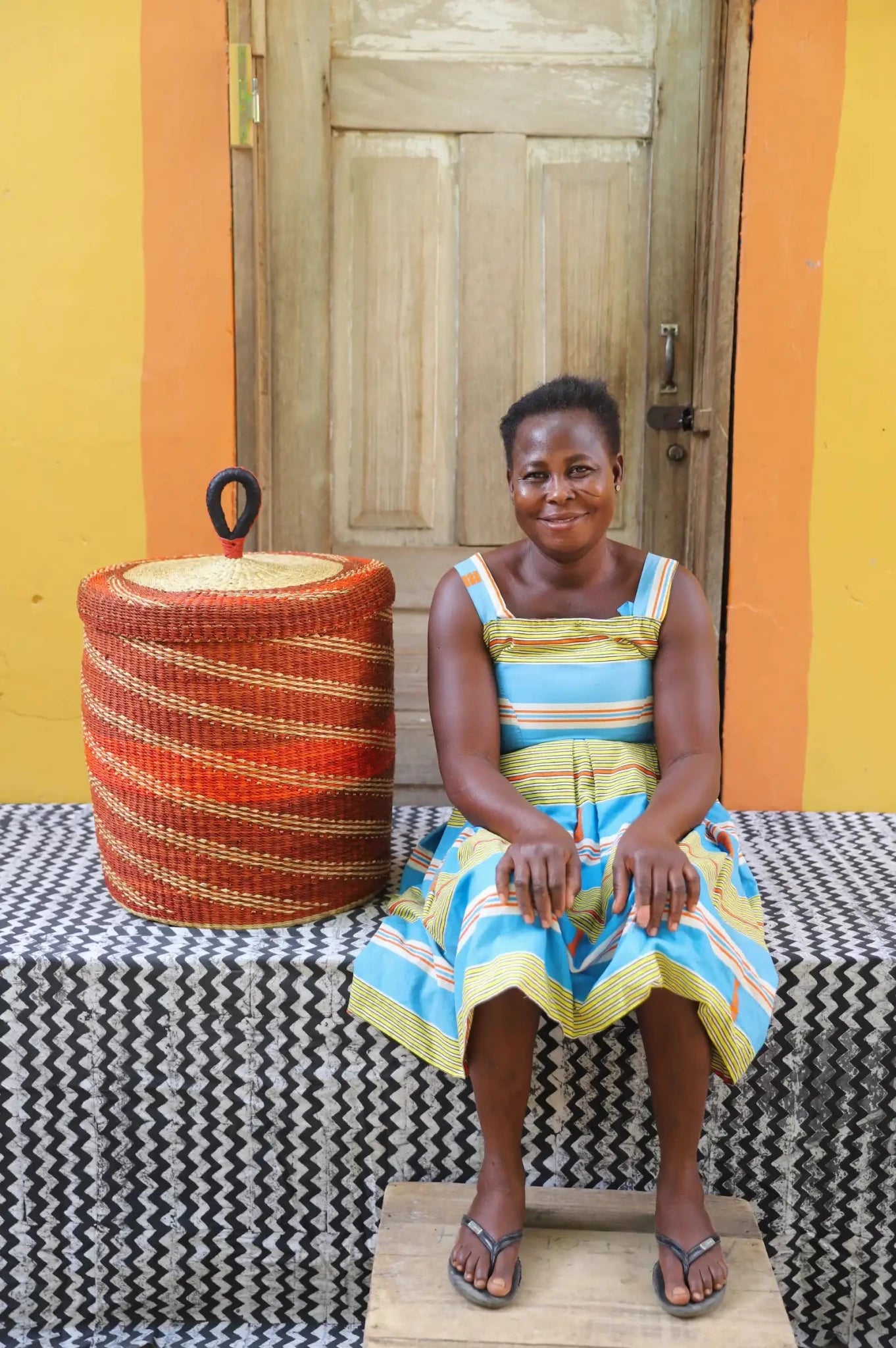 Lidded Laundry Basket (Medium) by The Baba Tree. Handwoven elephant grass with leather handle. Premium Bolgatanga artisan decor.