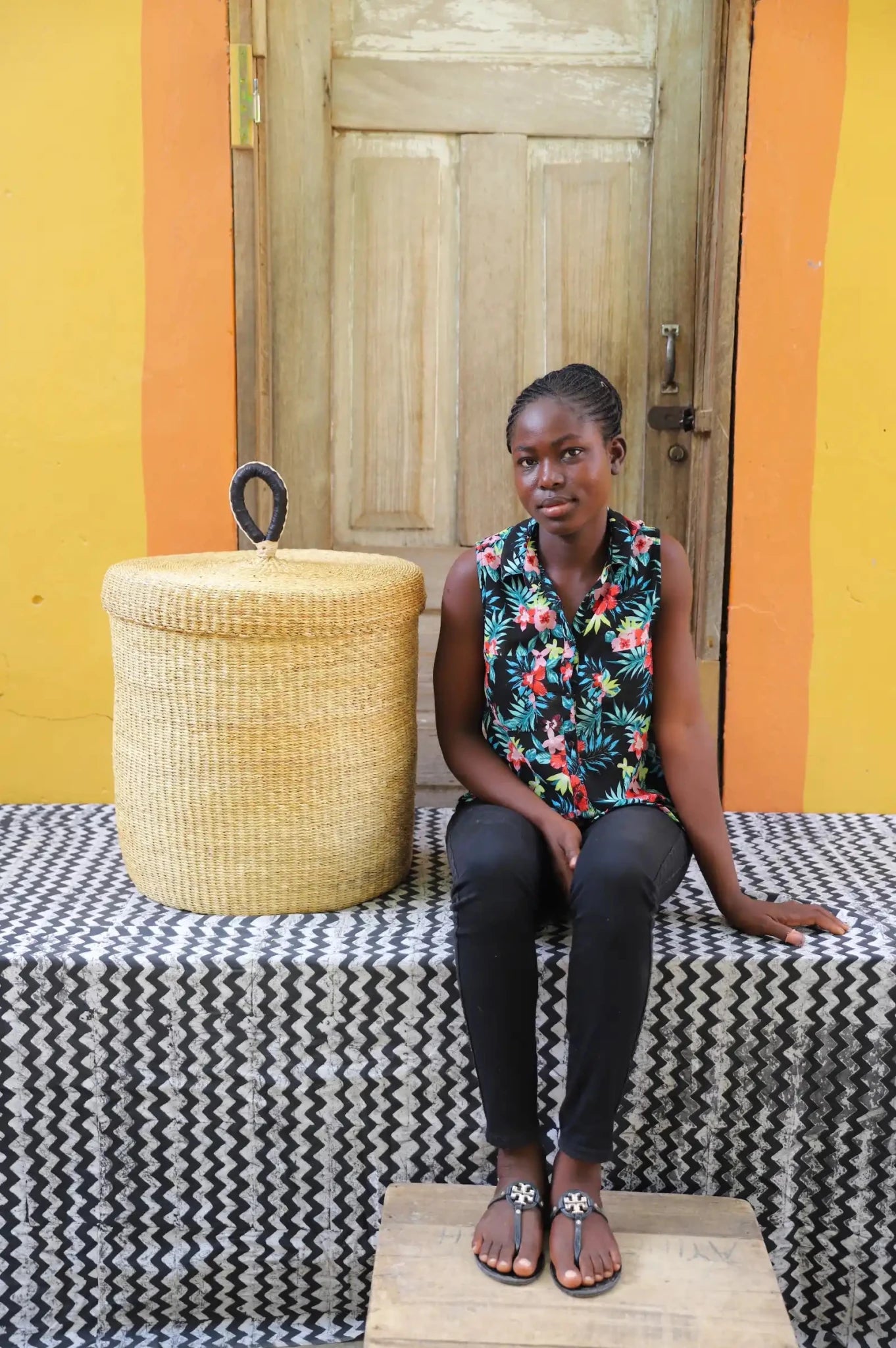 Lidded Laundry Basket (Medium) by The Baba Tree. Handwoven elephant grass with leather handle. Premium Bolgatanga artisan decor.