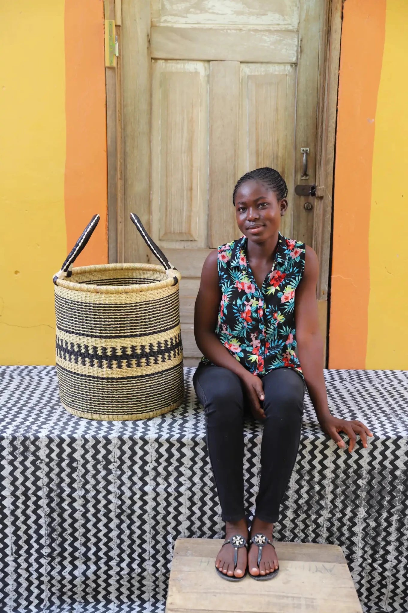 Open Laundry Basket (Small) by The Baba Tree. Handwoven elephant grass storage with leather handles. Bolgatanga artisan decor.