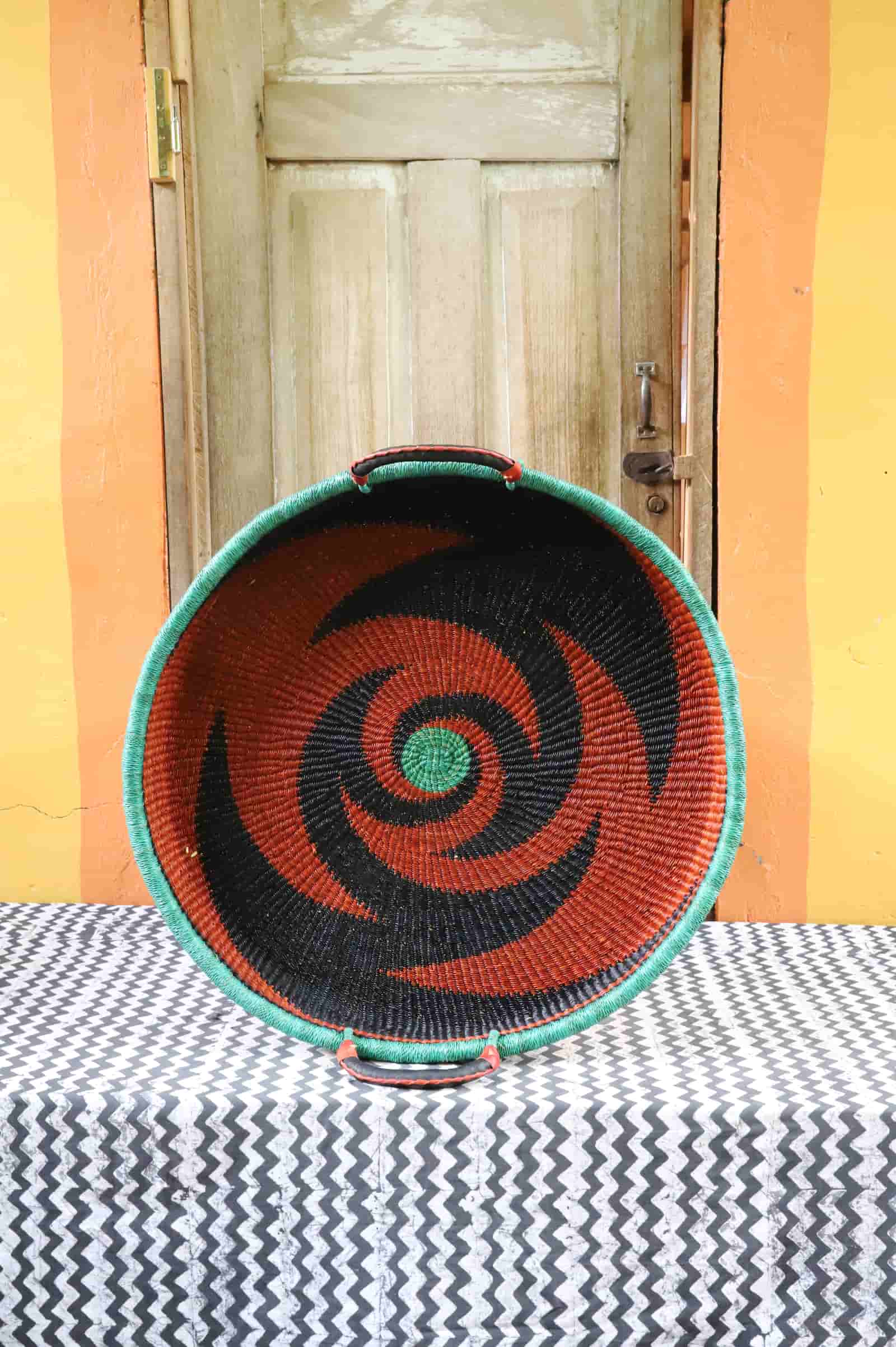 Handwoven architectural wall art with intricate weave and premium leather handle.