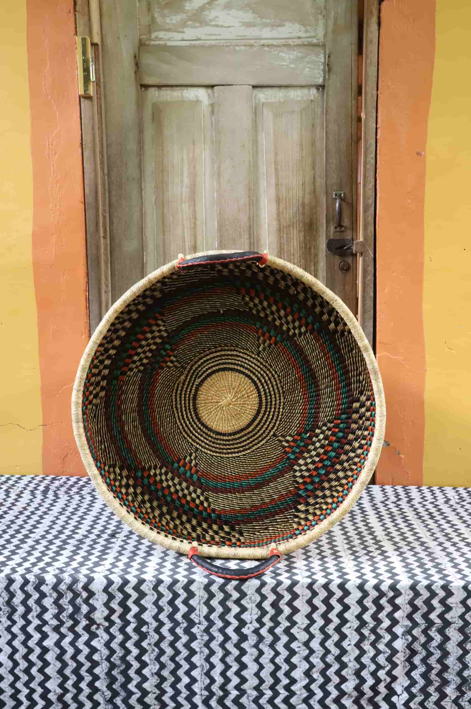Handwoven architectural wall art with intricate weave and premium leather handle.