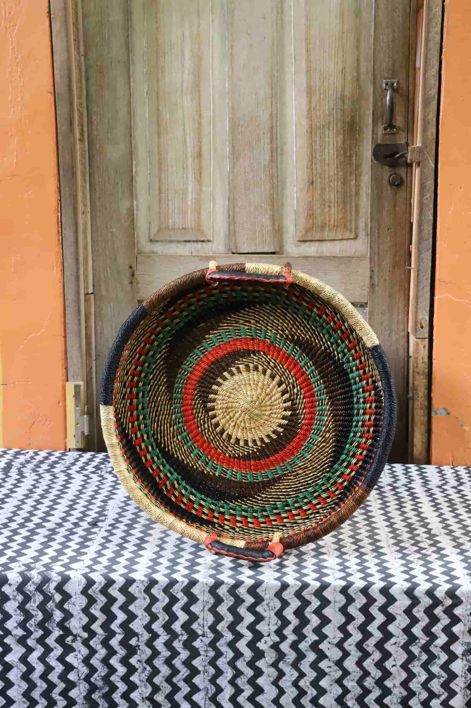 Handwoven architectural wall art with intricate weave and premium leather handle.