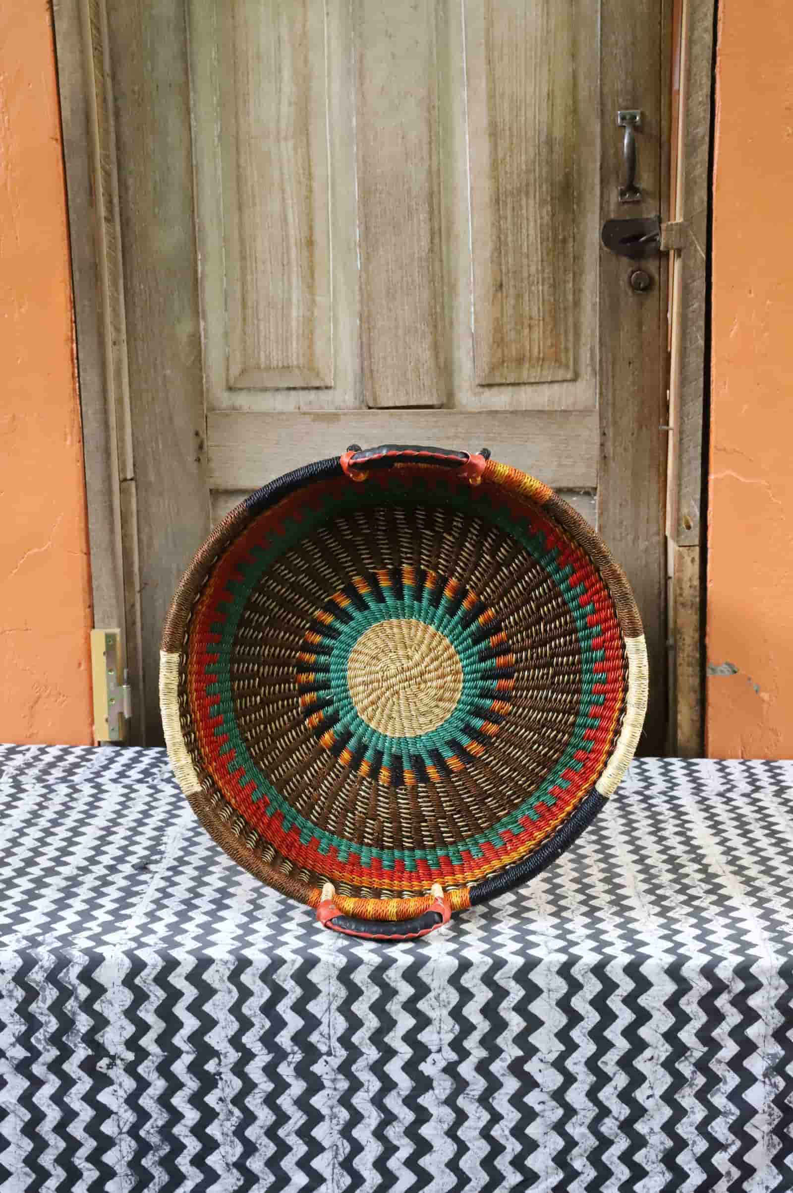 Handwoven architectural wall art with intricate weave and premium leather handle.