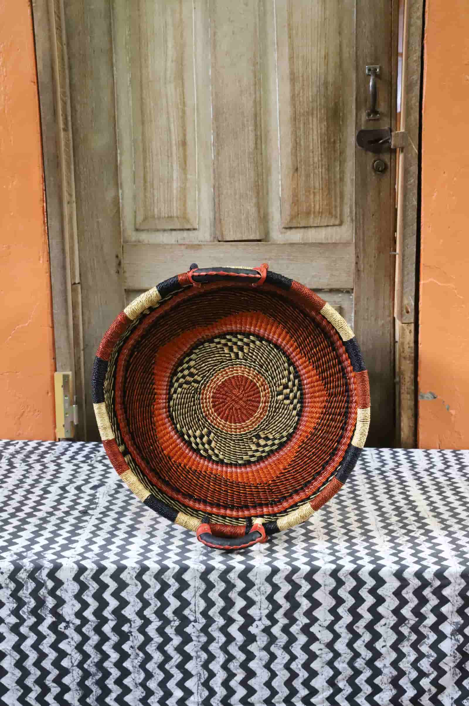 Handwoven architectural wall art with intricate weave and premium leather handle.