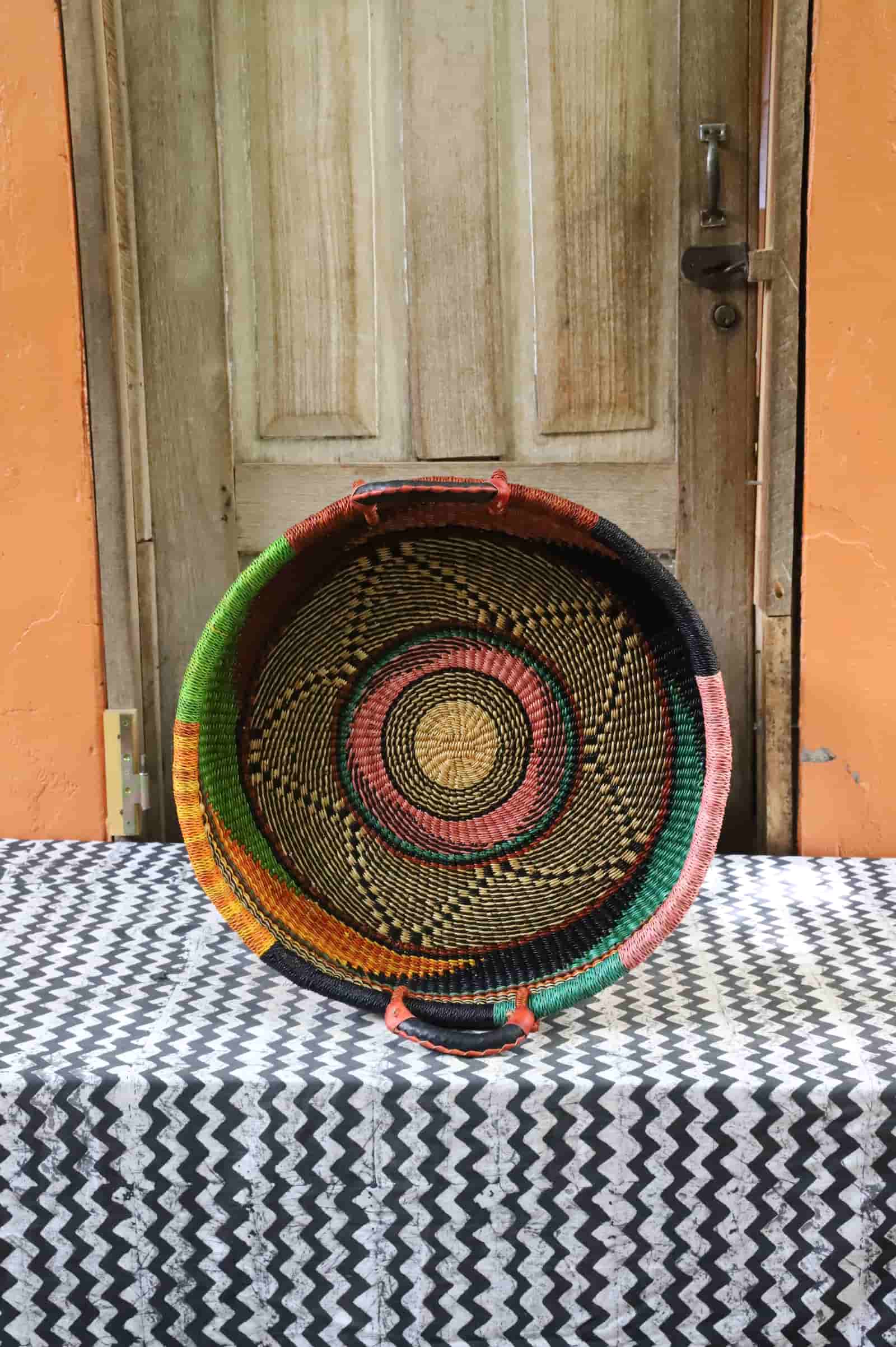 Handwoven architectural wall art with intricate weave and premium leather handle.