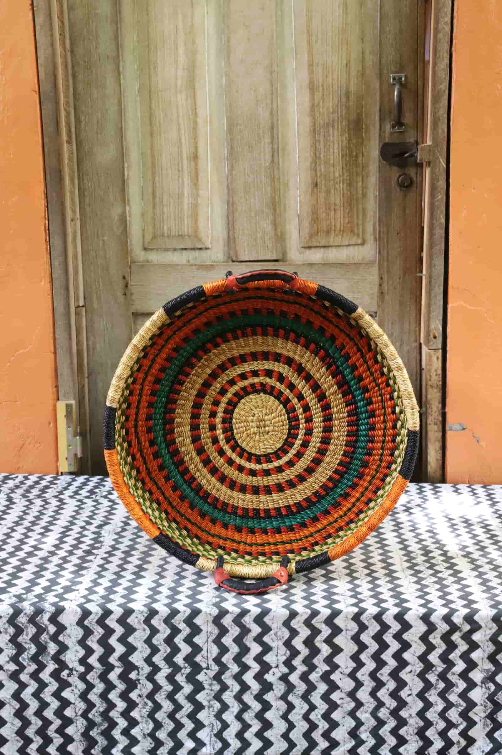 Handwoven architectural wall art with intricate weave and premium leather handle.