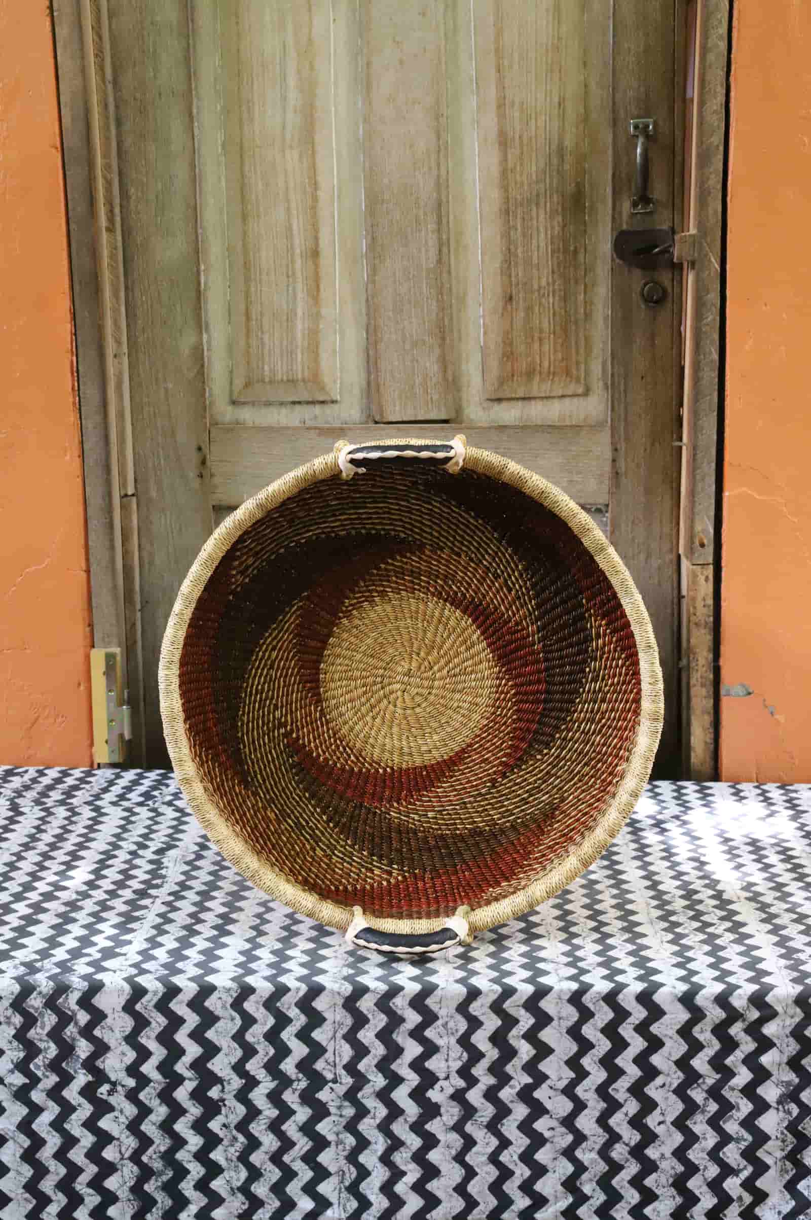 Handwoven architectural wall art with intricate weave and premium leather handle.