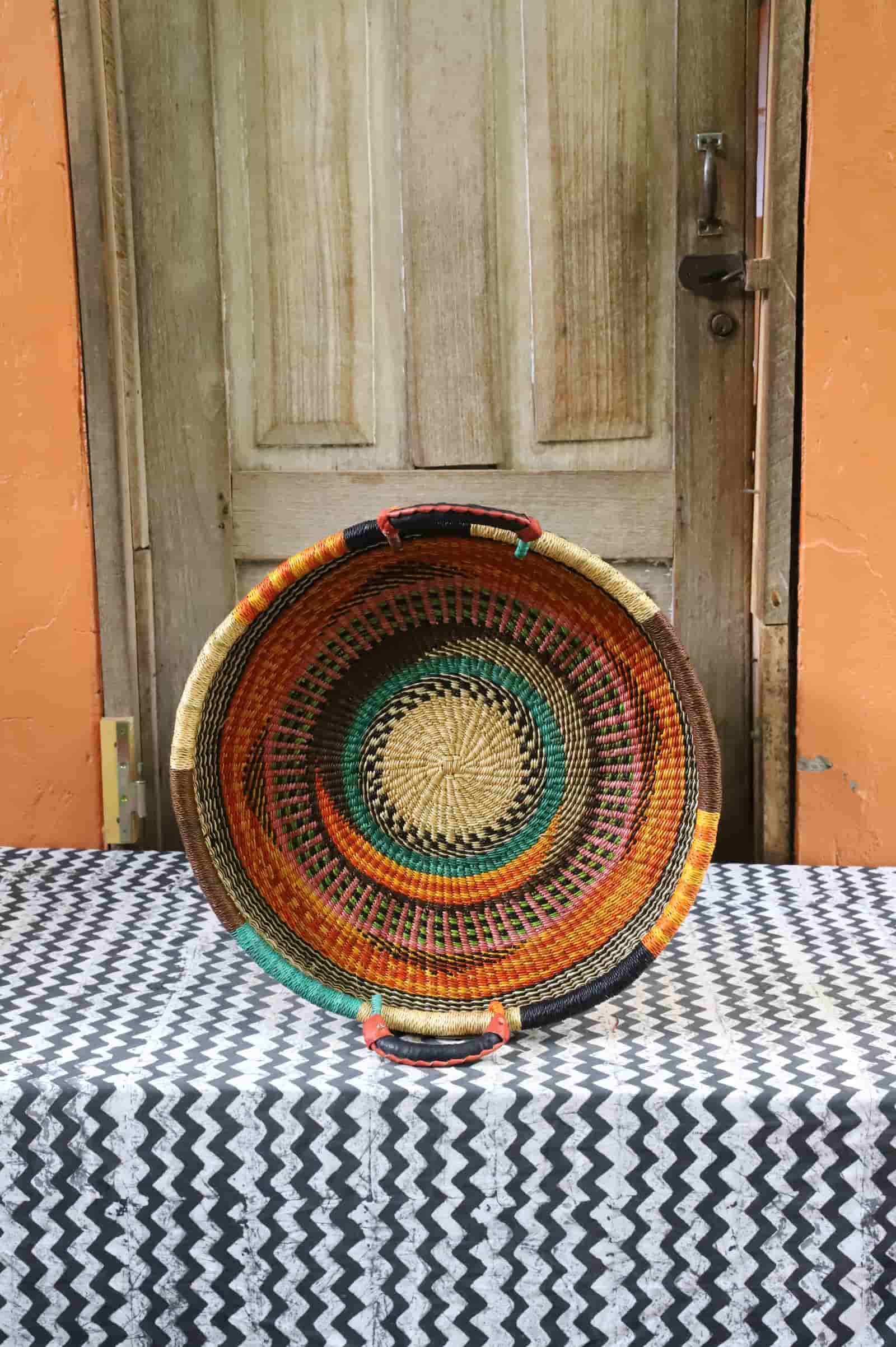 Handwoven architectural wall art with intricate weave and premium leather handle.