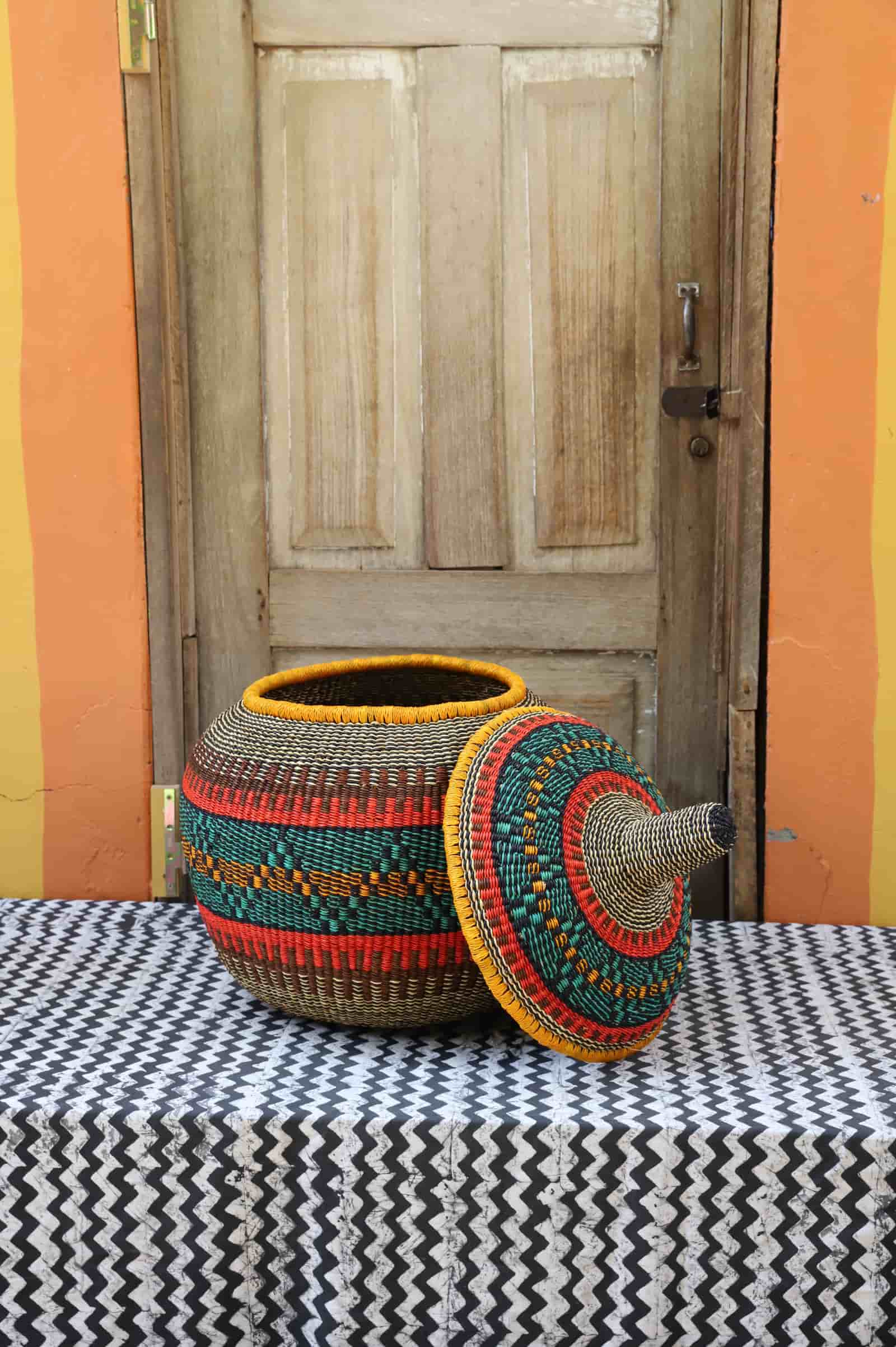 Large Orbit storage basket in dark teal with orange and red stripe pattern, lid off