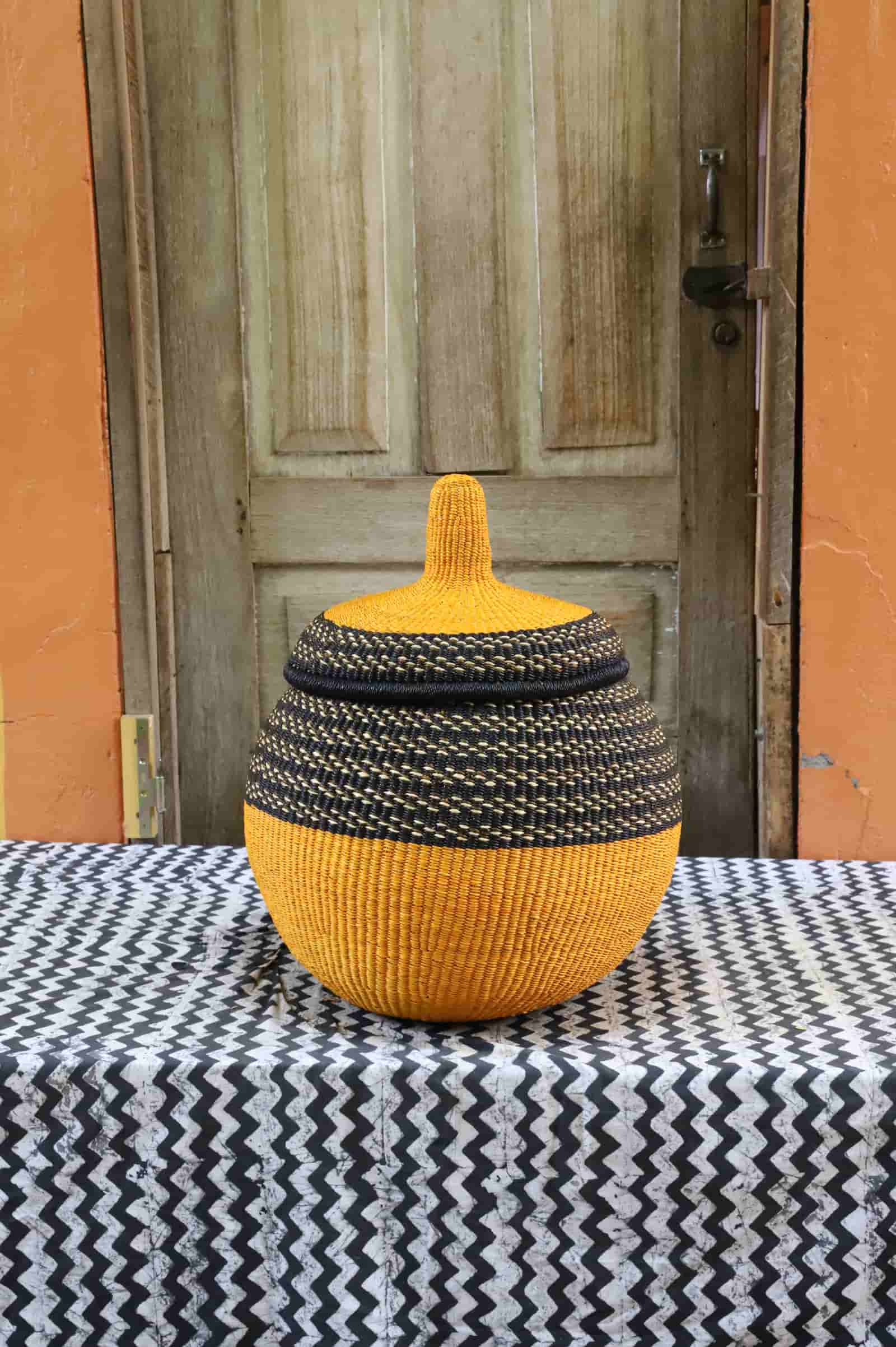 Orbit storage basket large: yellow and black stripe globe with lid, front view