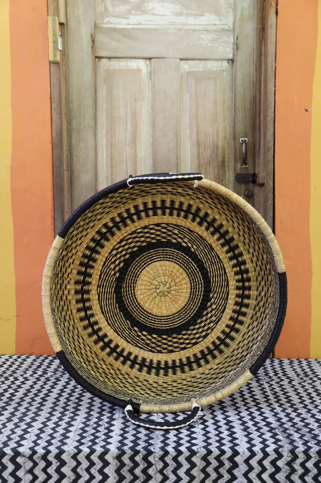Woven Tray Wall Decor (Large) by The Baba Tree. Premium elephant grass tray with leather handles. Bolgatanga artisan craftsmanship.
