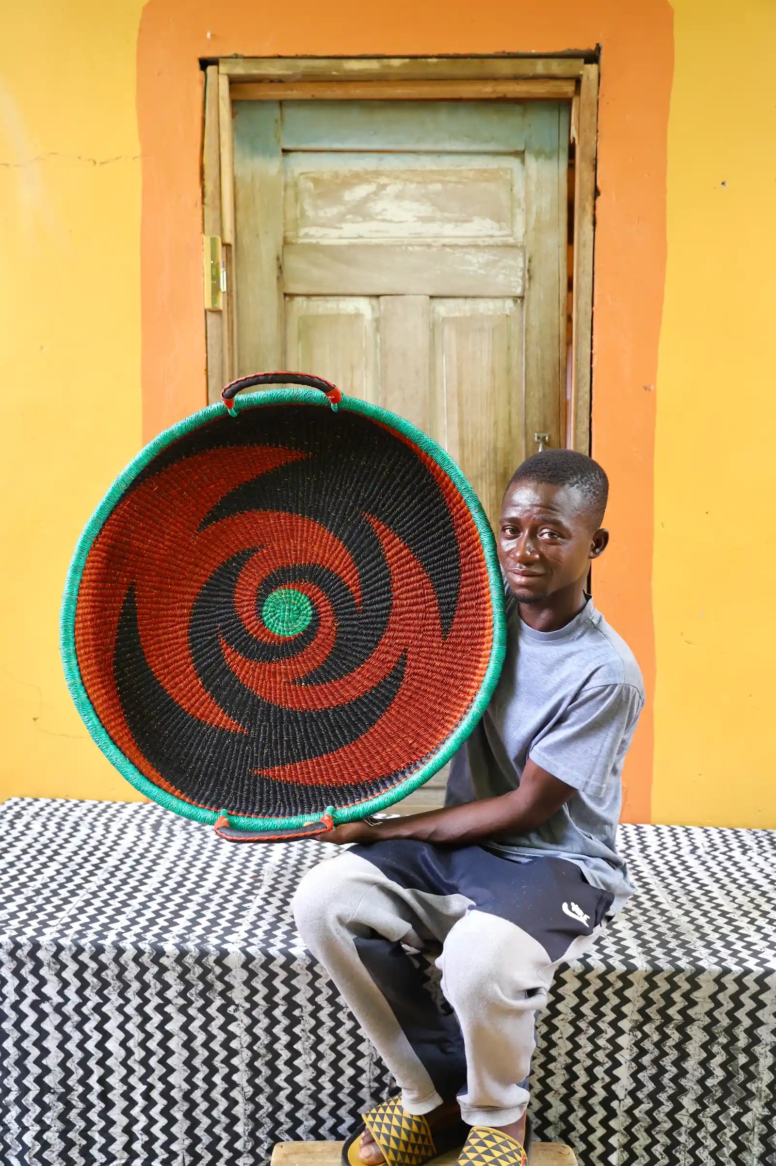 Handwoven architectural wall art with intricate weave and premium leather handle.
