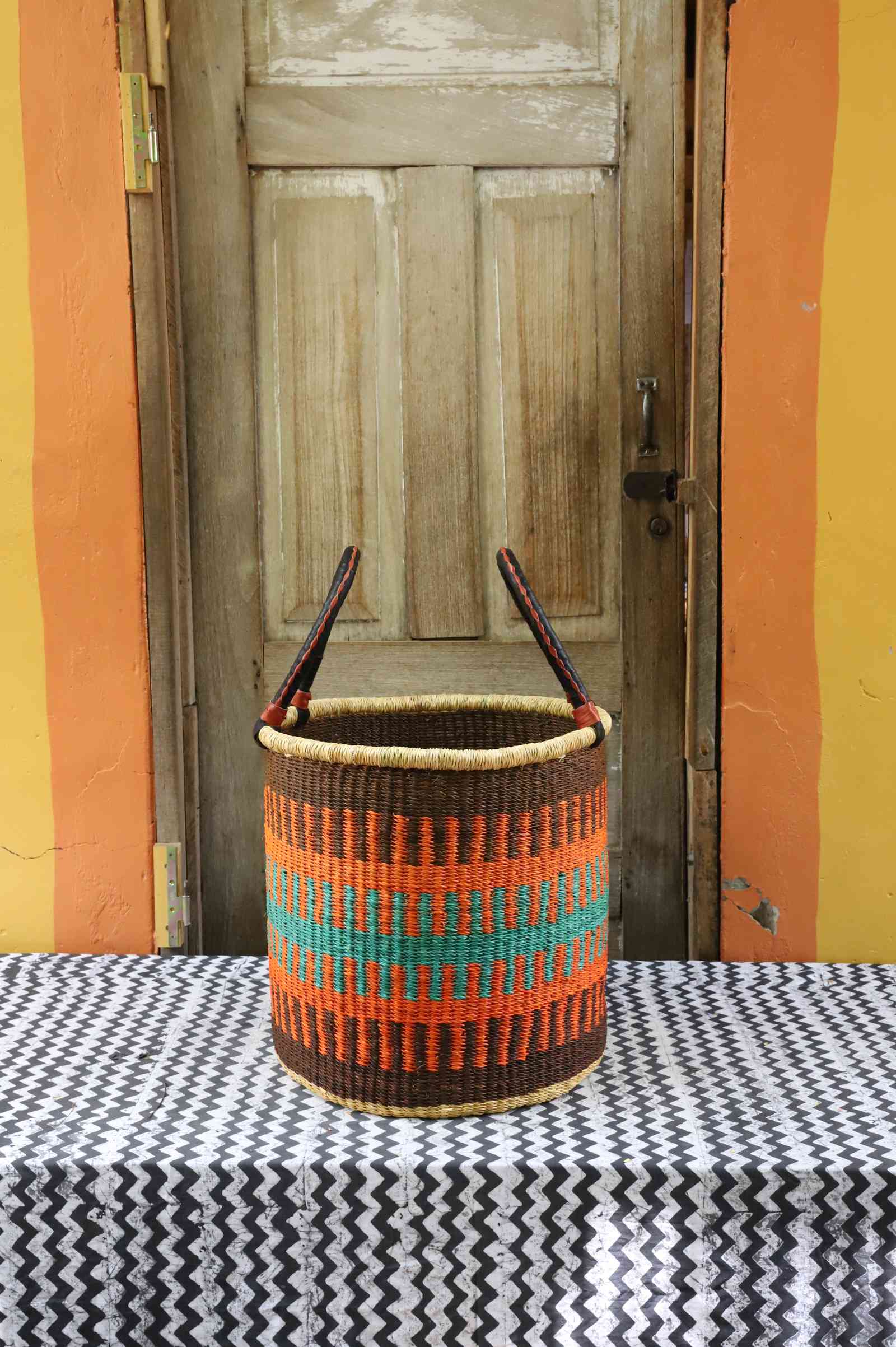 Medium open laundry basket, a handwoven Bolga basket in elephant grass, 46 cm wide.