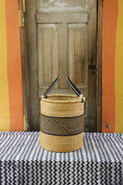 Handwoven African basket for laundry in elephant grass, open topped for daily use.