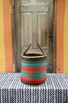 Small open laundry basket, a handwoven Bolga basket in elephant grass, 38 cm wide.
