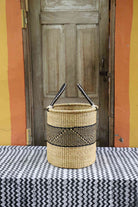 Open laundry basket handwoven from elephant grass, 43 cm wide and 46 cm tall.