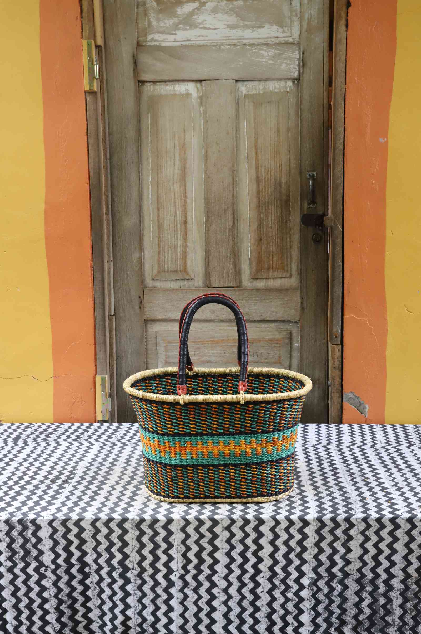 Large handwoven Bolga Zaane Tia market basket in natural straw with teal and multicolour fine banded stripes.