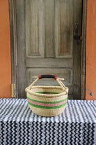 Round shopping basket in elephant grass, handwoven to carry real weight.