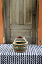 Round shopping basket in elephant grass, a handwoven Bolga basket from northern Ghana.